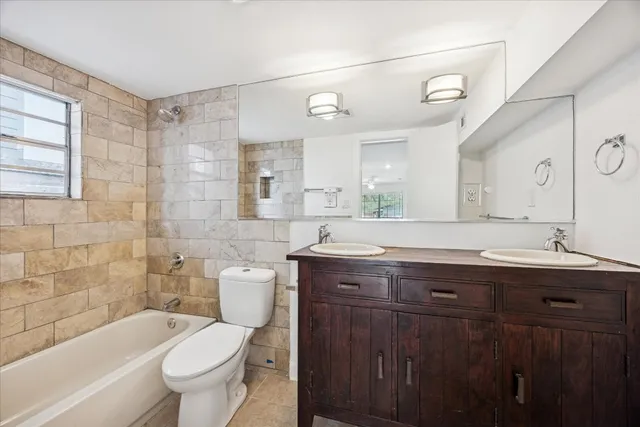 a view of a backyard with a tree