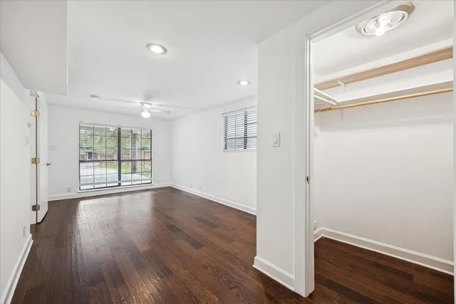 a bathroom with a granite countertop toilet a sink and a bathtub