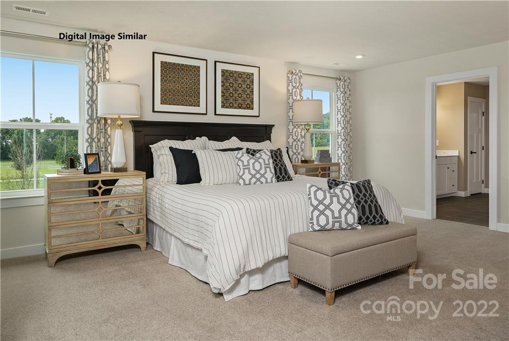 3010 Ballester Road, Unit 246 Indian Land, SC 29707 - Photo 7 of 14 a bedroom with a bed and a couch