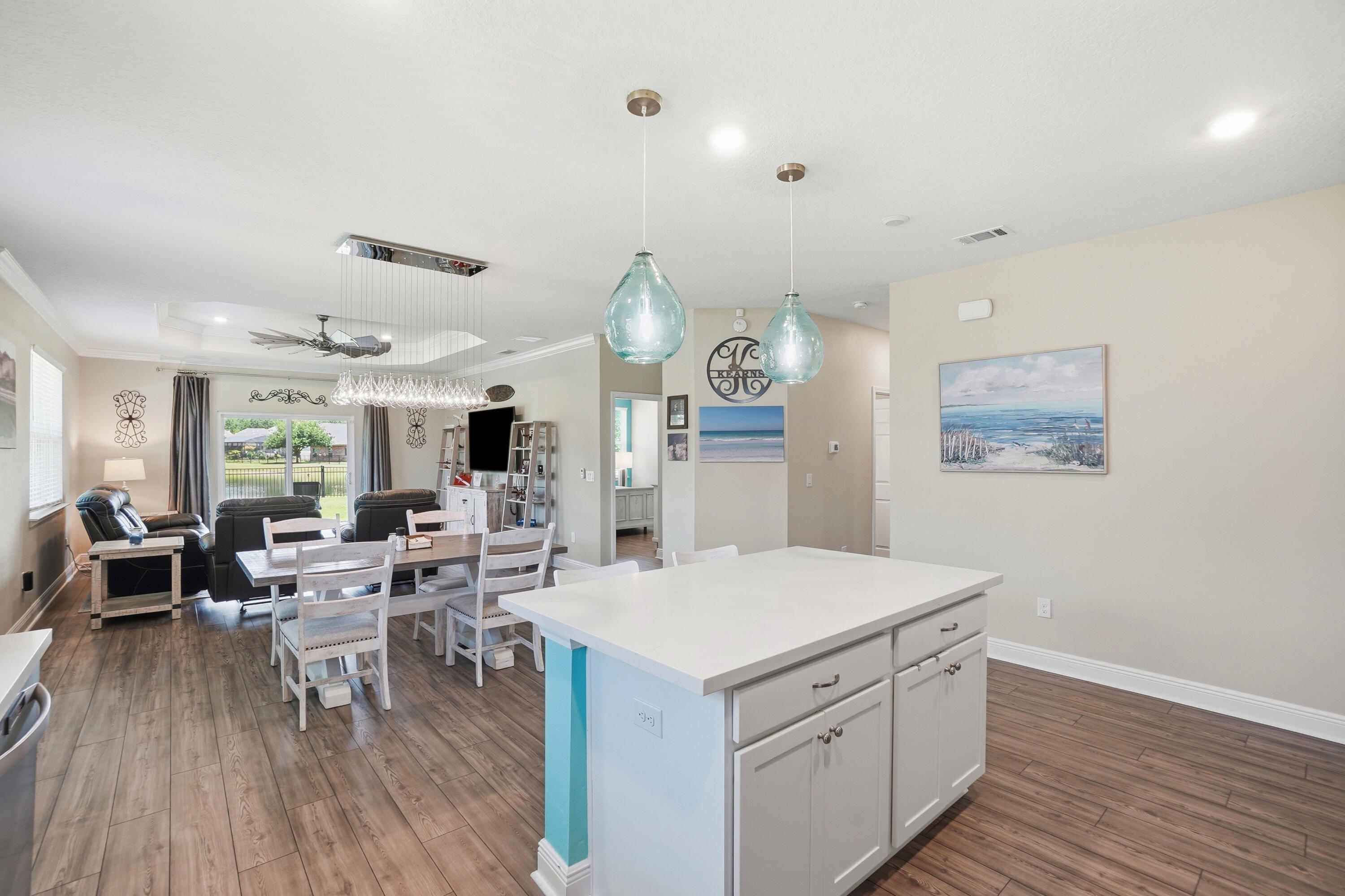 525 Windchime Way Freeport, FL 32439 - Photo 9 of 59 a view of living room with wooden floor and white walls