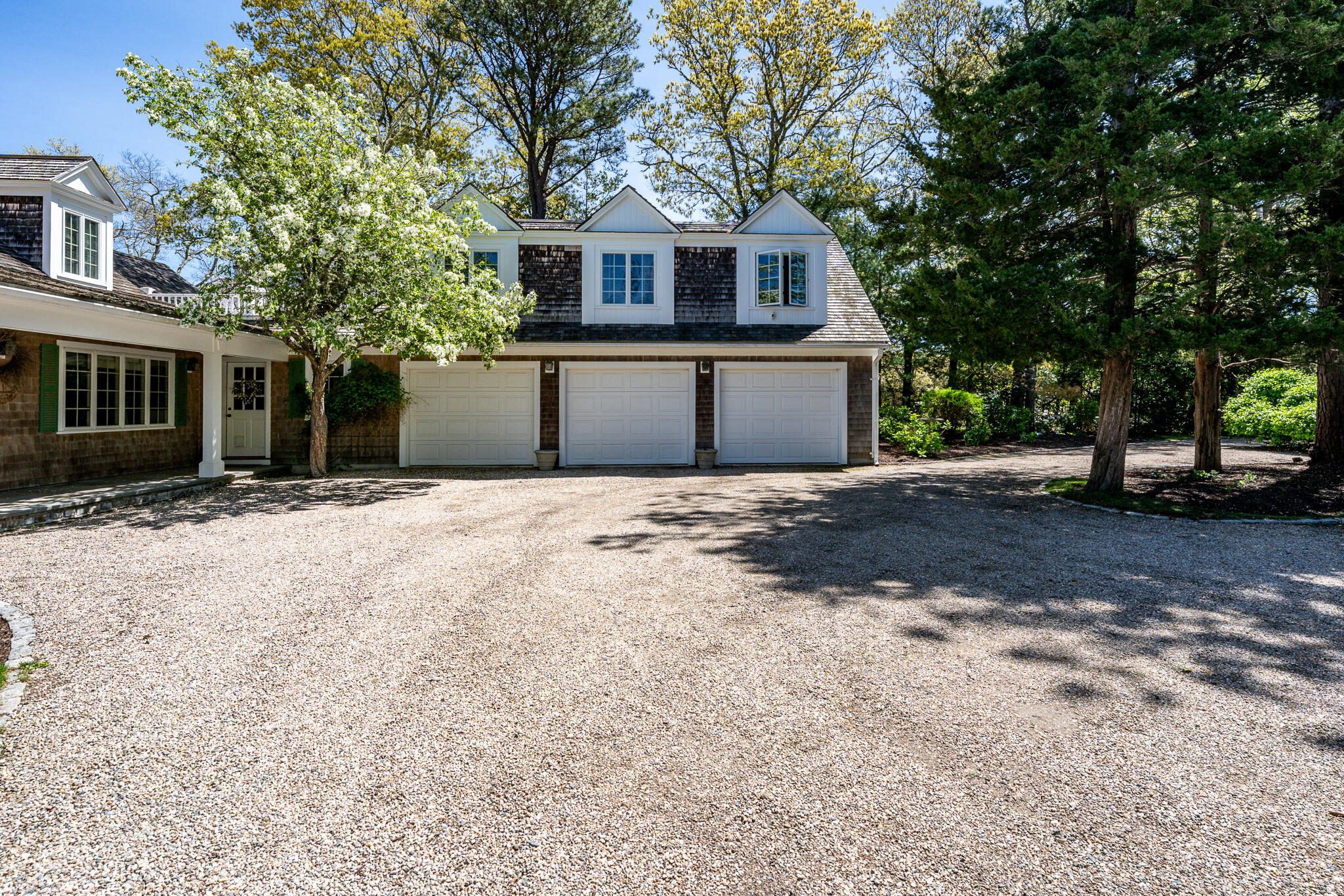 46 Great Bay Road Osterville, MA 02655 - Photo 51 of 54 a front view of a house with a garden