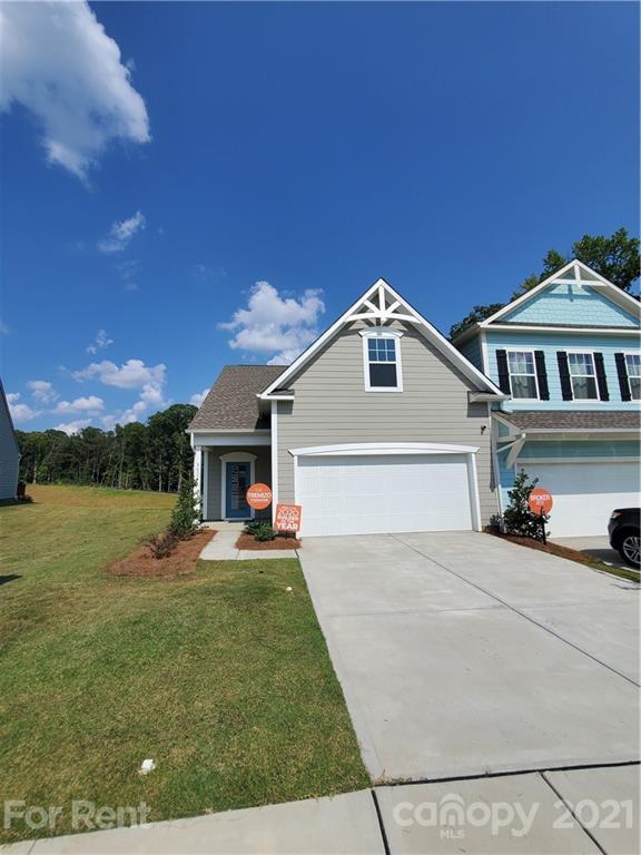 8633 River Ridge Drive Charlotte, NC 28213 - Photo 1 of 23 a front view of a house with a yard and garage