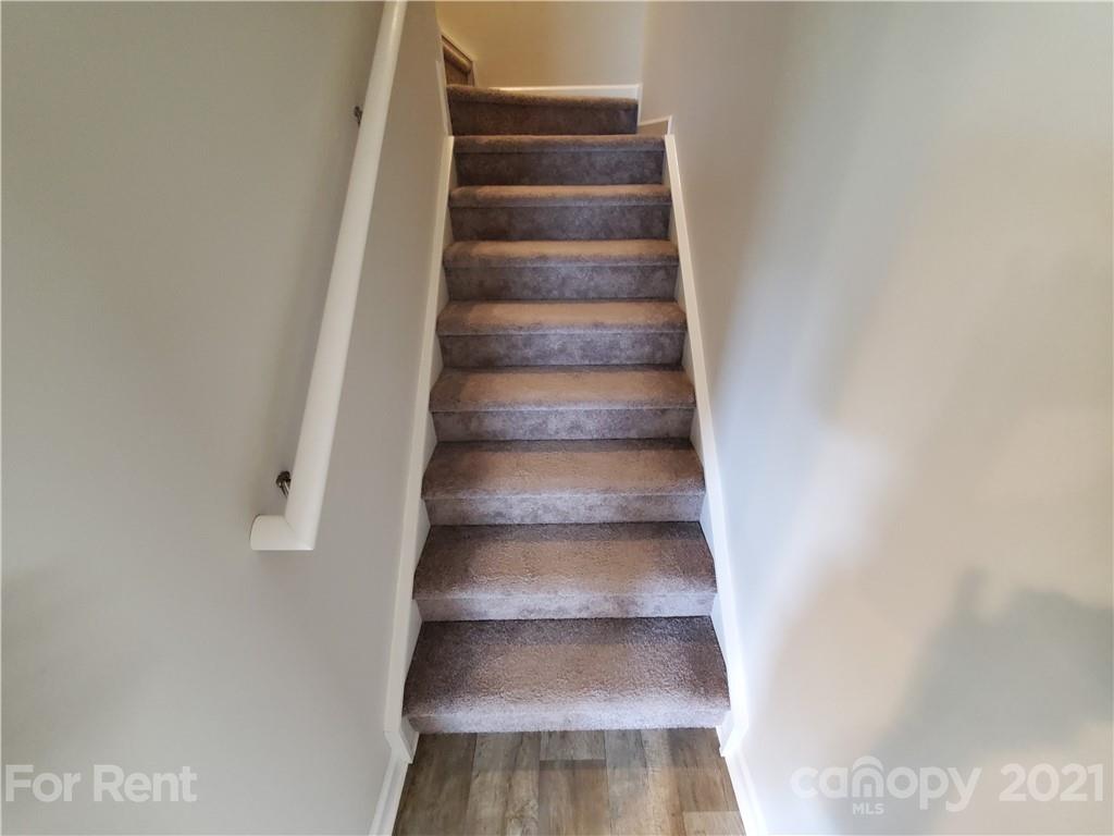 8633 River Ridge Drive Charlotte, NC 28213 - Photo 15 of 23 a view of staircase with white walls
