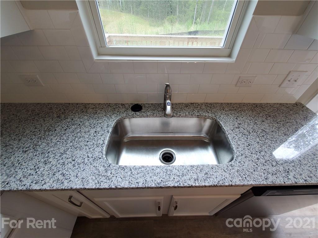 8633 River Ridge Drive Charlotte, NC 28213 - Photo 8 of 23 a bathroom with a granite countertop sink and mirror