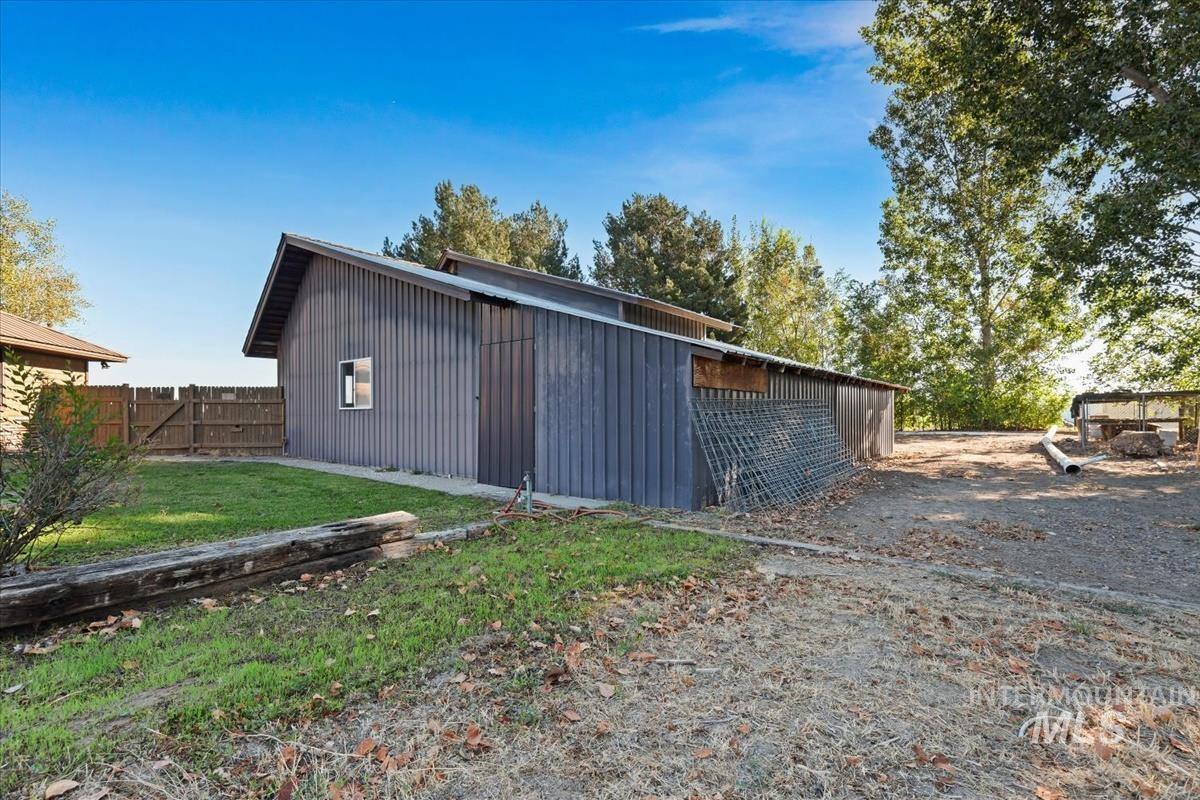 8275 Washoe Road Fruitland, ID 83619 - Photo 28 of 43 Shed structure with vertical siding and a sloped roof