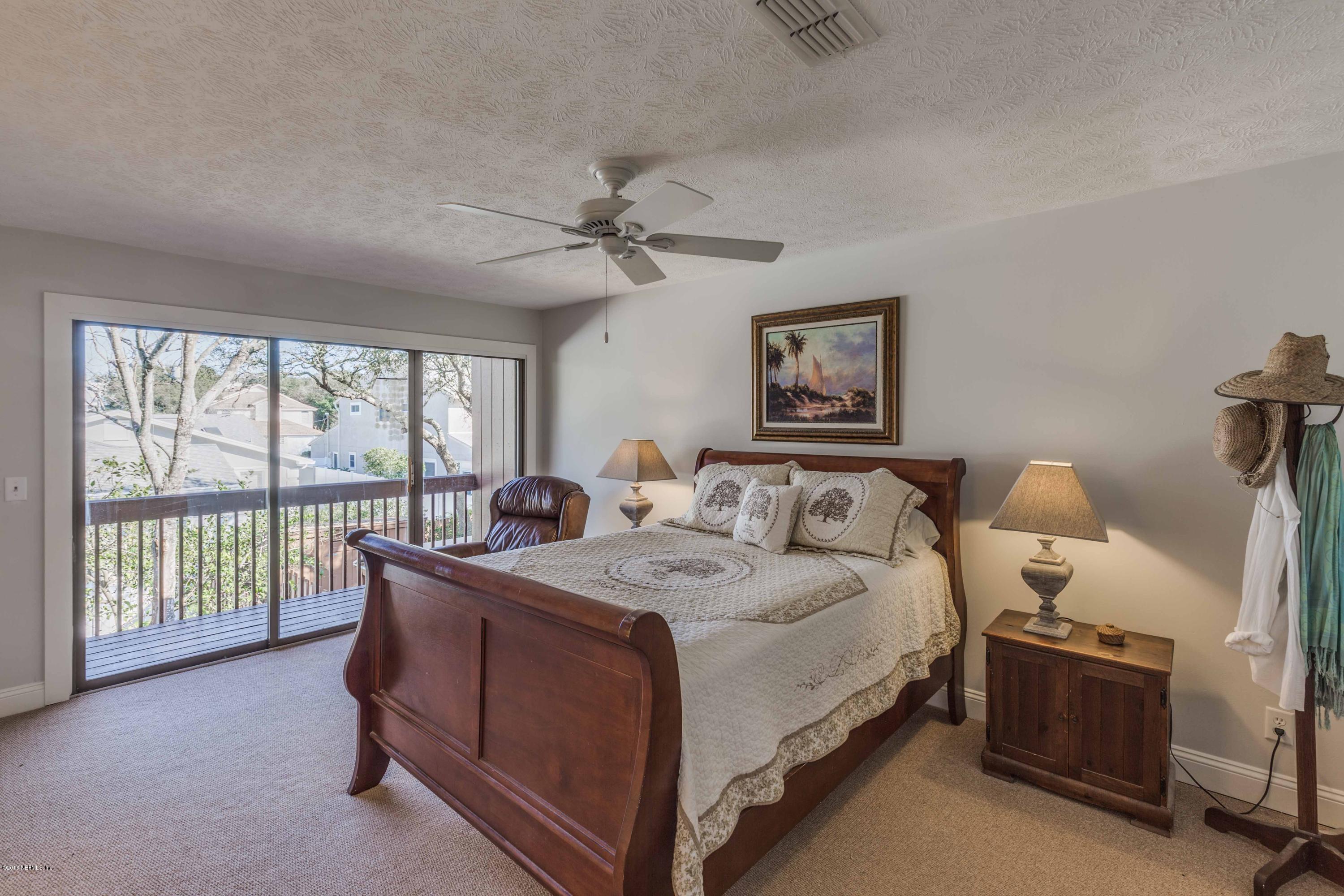 1755 Seminole Road Atlantic Beach, FL 32233 - Photo 12 of 28 a room with a bed and a large window
