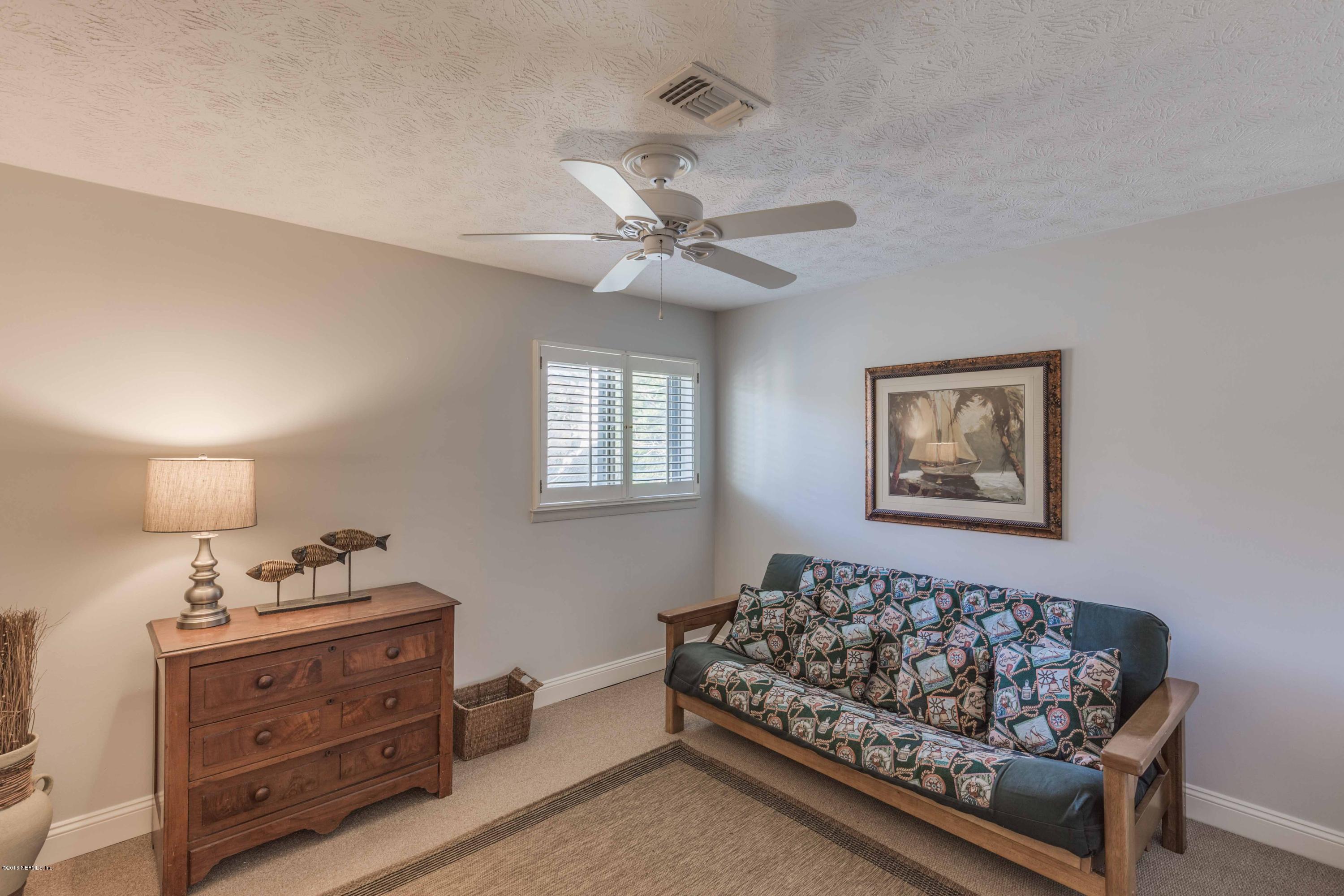 1755 Seminole Road Atlantic Beach, FL 32233 - Photo 17 of 28 a bed room with a bed and a window