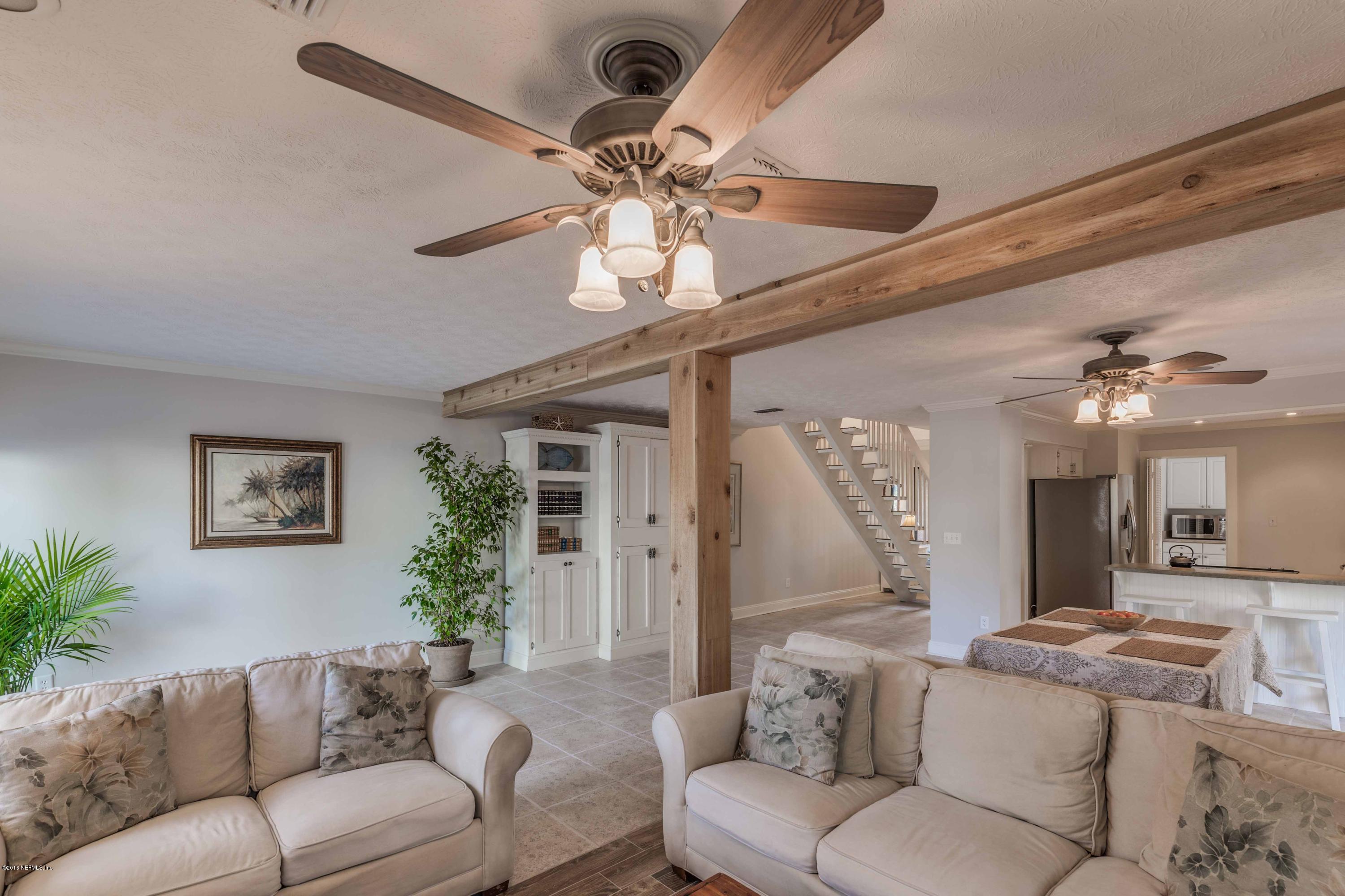 1755 Seminole Road Atlantic Beach, FL 32233 - Photo 2 of 28 a living room with furniture and a large window