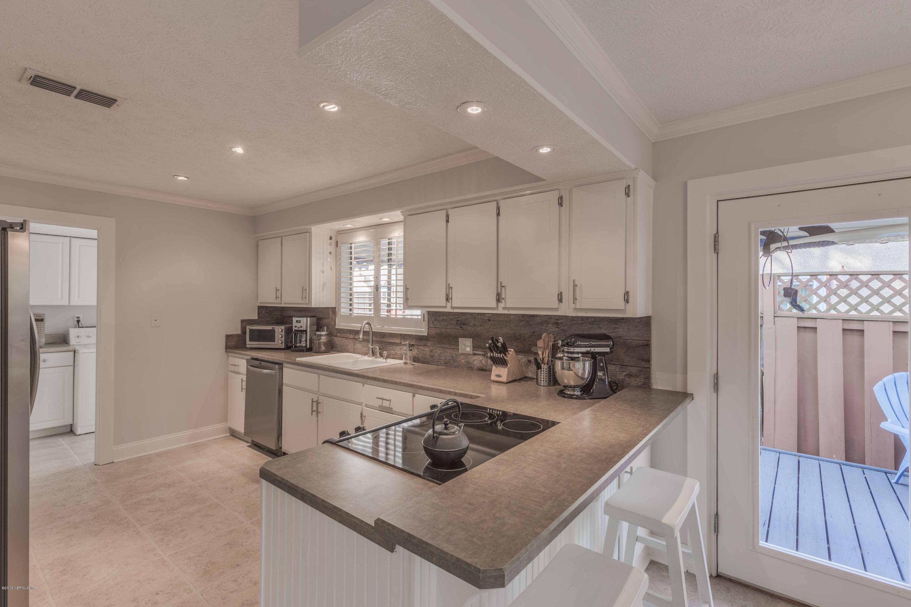 1755 Seminole Road Atlantic Beach, FL 32233 - Photo 3 of 28 a kitchen with stainless steel appliances granite countertop a stove a sink a refrigerator and a refrigerator