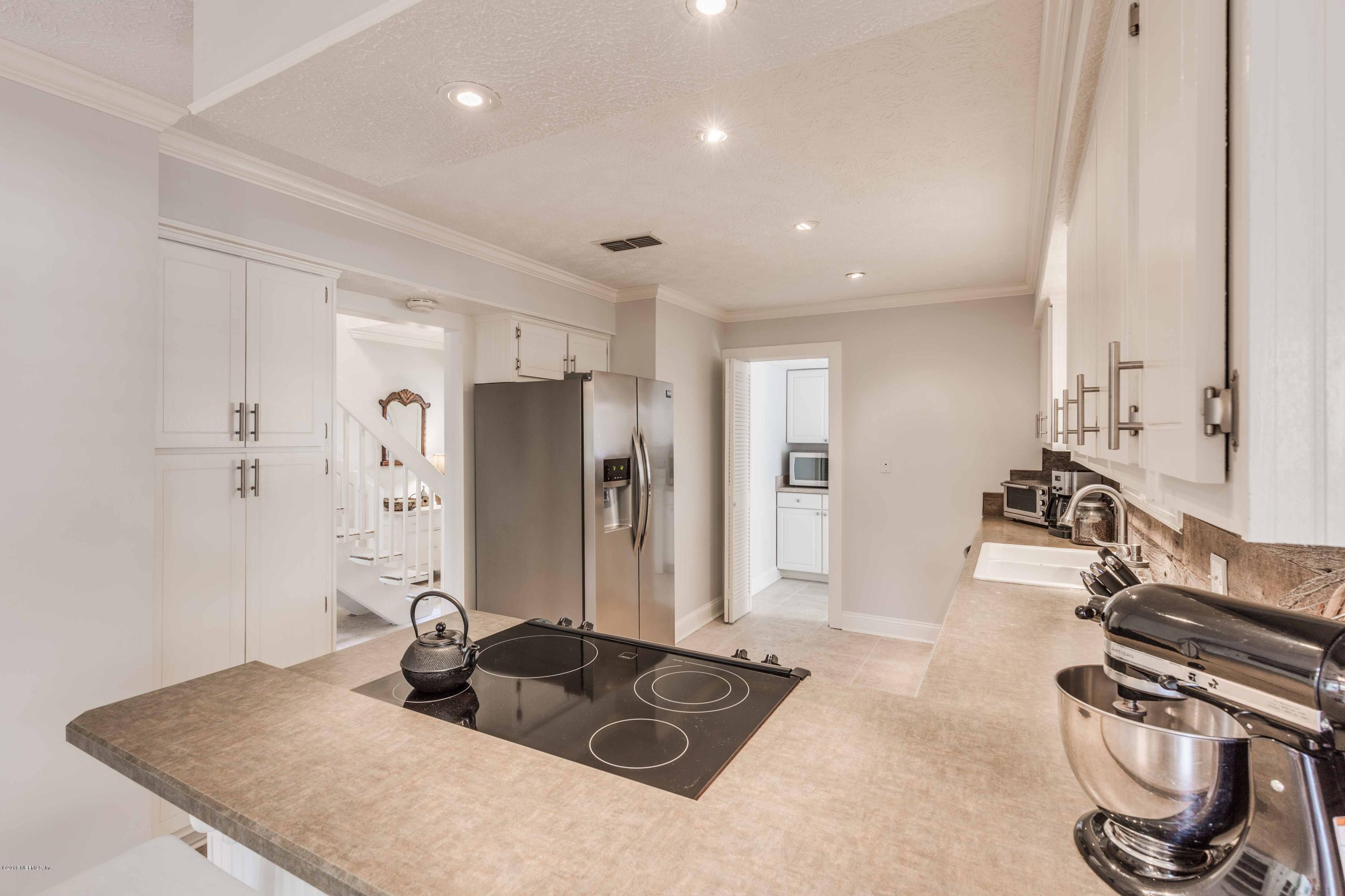 1755 Seminole Road Atlantic Beach, FL 32233 - Photo 5 of 28 a kitchen with stainless steel appliances granite countertop a sink stove and refrigerator