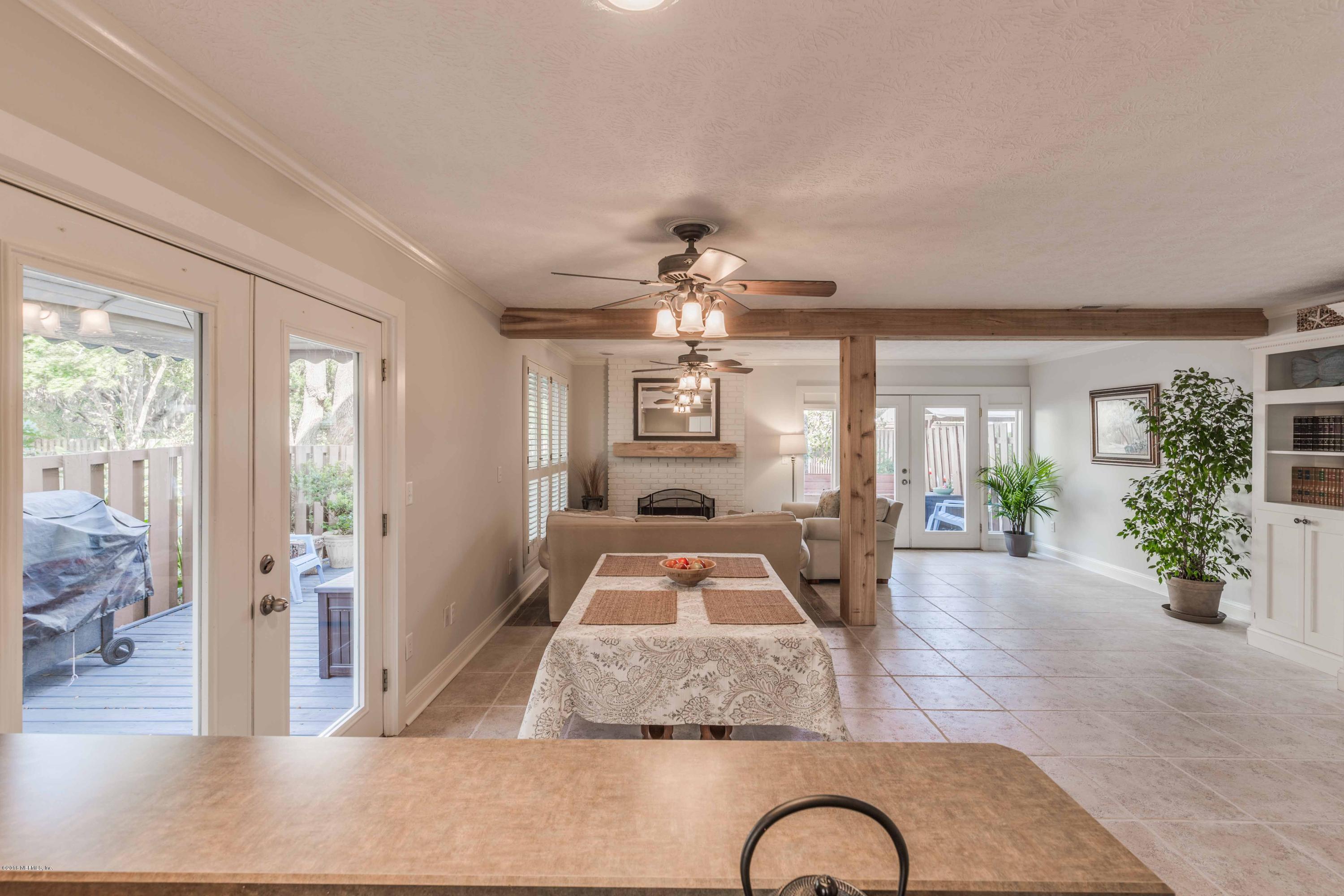 1755 Seminole Road Atlantic Beach, FL 32233 - Photo 7 of 28 a view of a livingroom with furniture wooden floor and windows