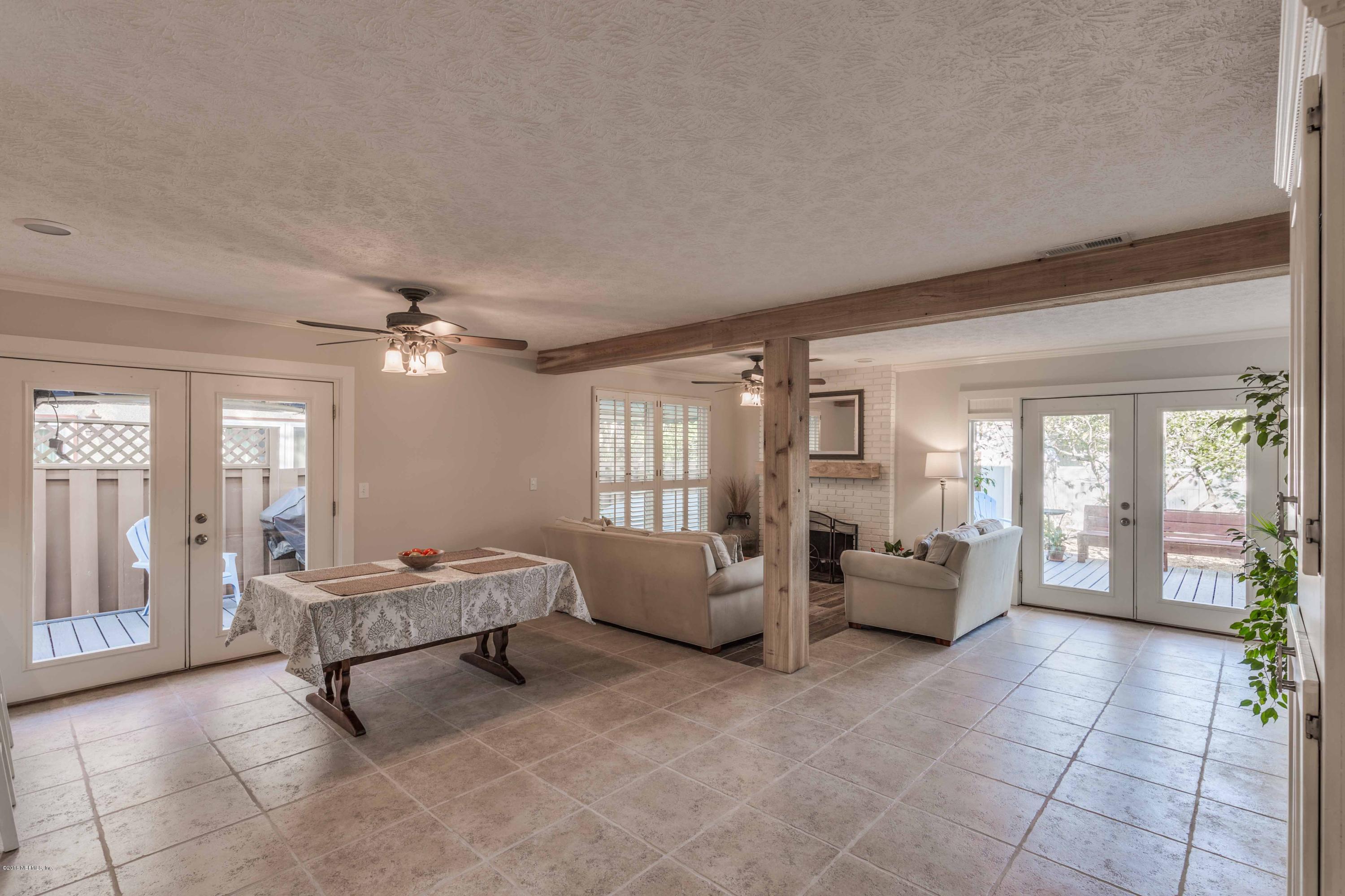 1755 Seminole Road Atlantic Beach, FL 32233 - Photo 9 of 28 a living room with furniture and large windows