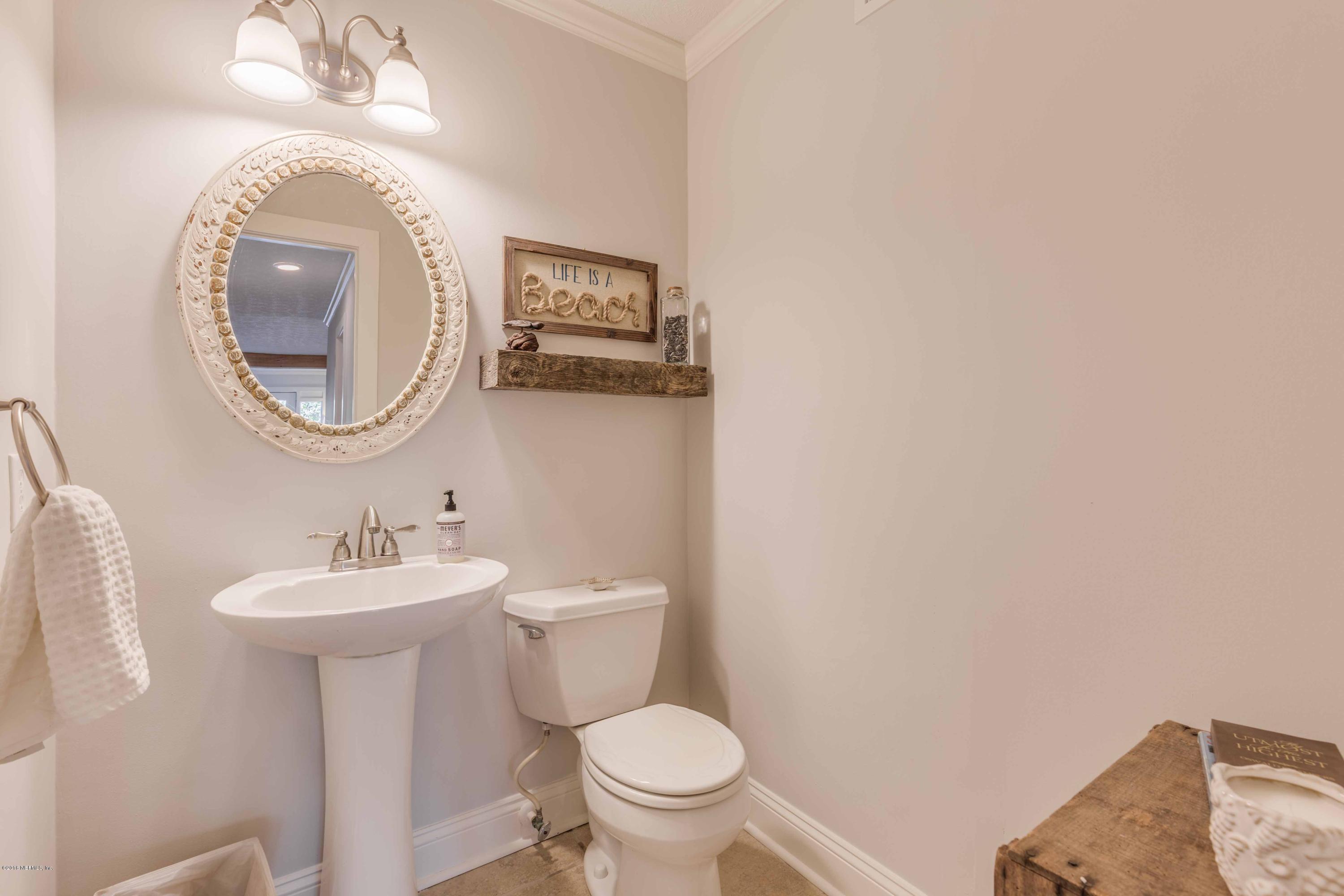 1755 Seminole Road Atlantic Beach, FL 32233 - Photo 10 of 28 a bathroom with a sink and a mirror