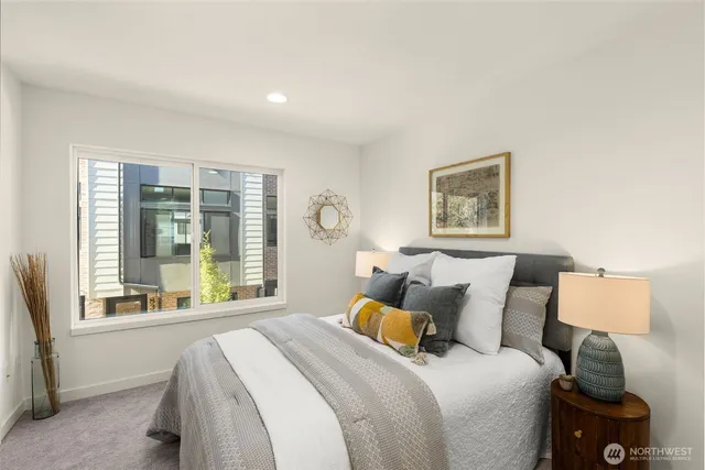 a bed room with a bed and a window