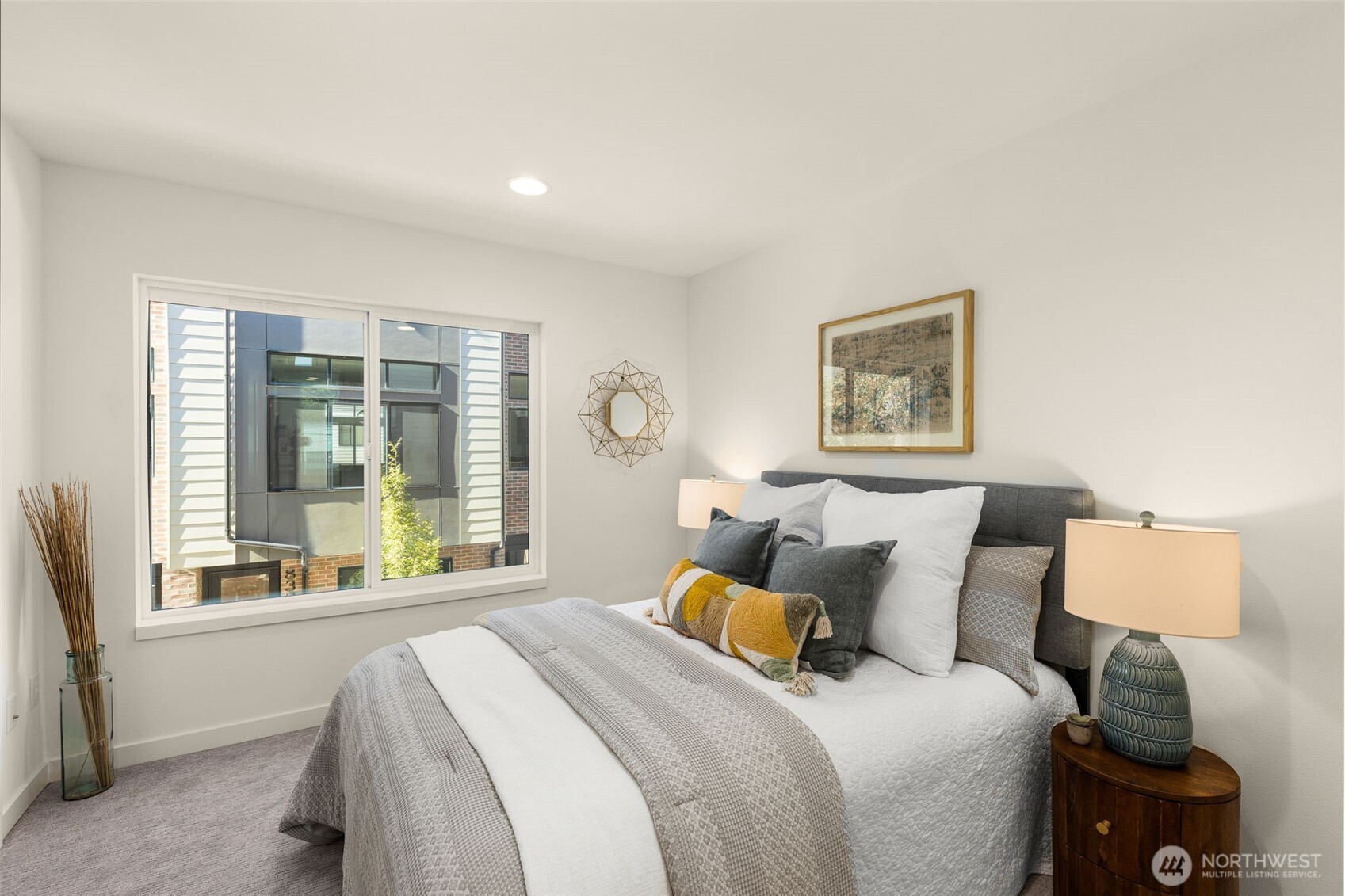 8333 C 12th Avenue Northwest Seattle, WA 98117 - Photo 13 of 24 a bed room with a bed and a window