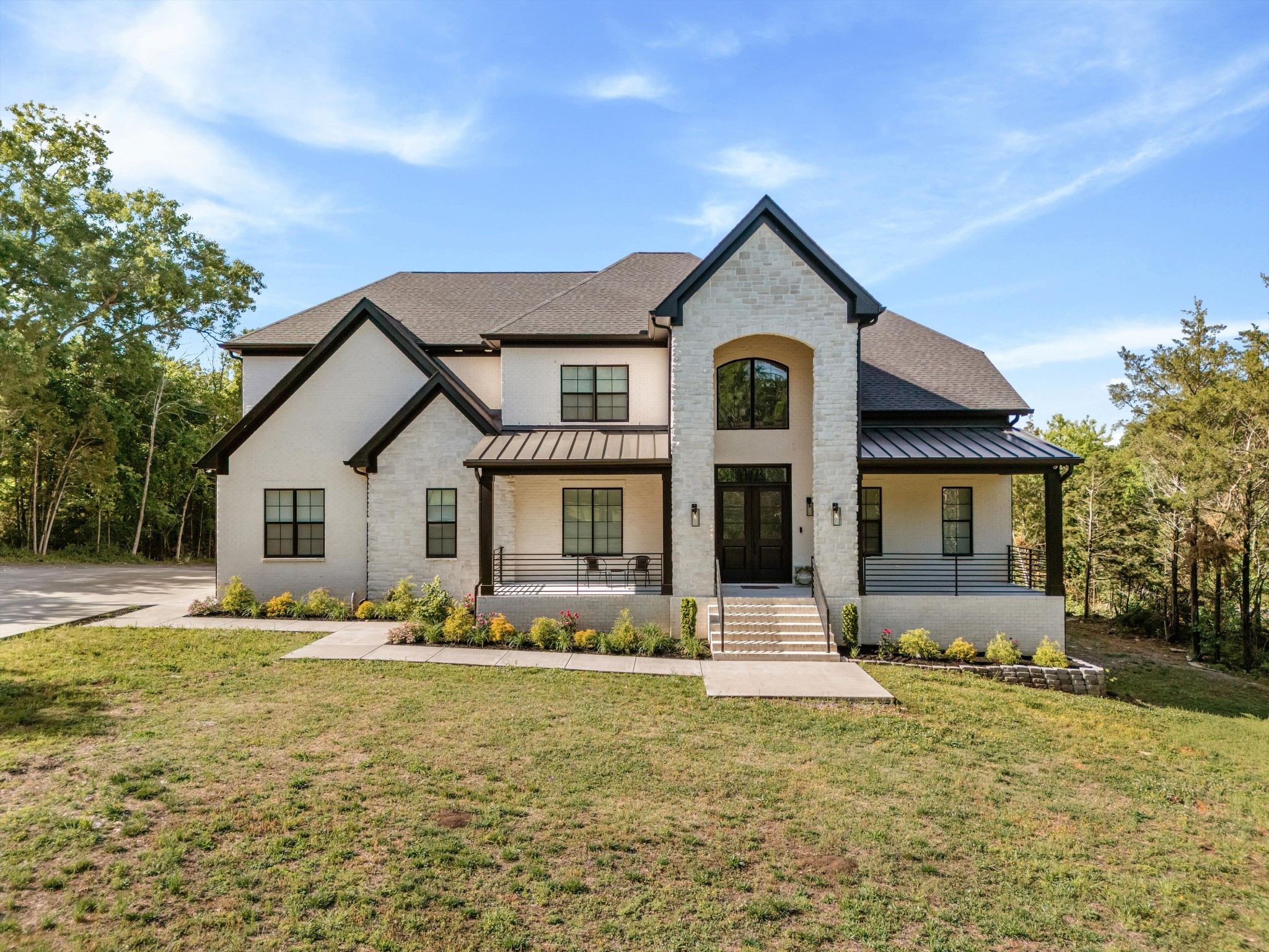 2085 Kidd Road Nolensville, TN 37135 - Photo 5 of 88 a front view of house with yard and trees around