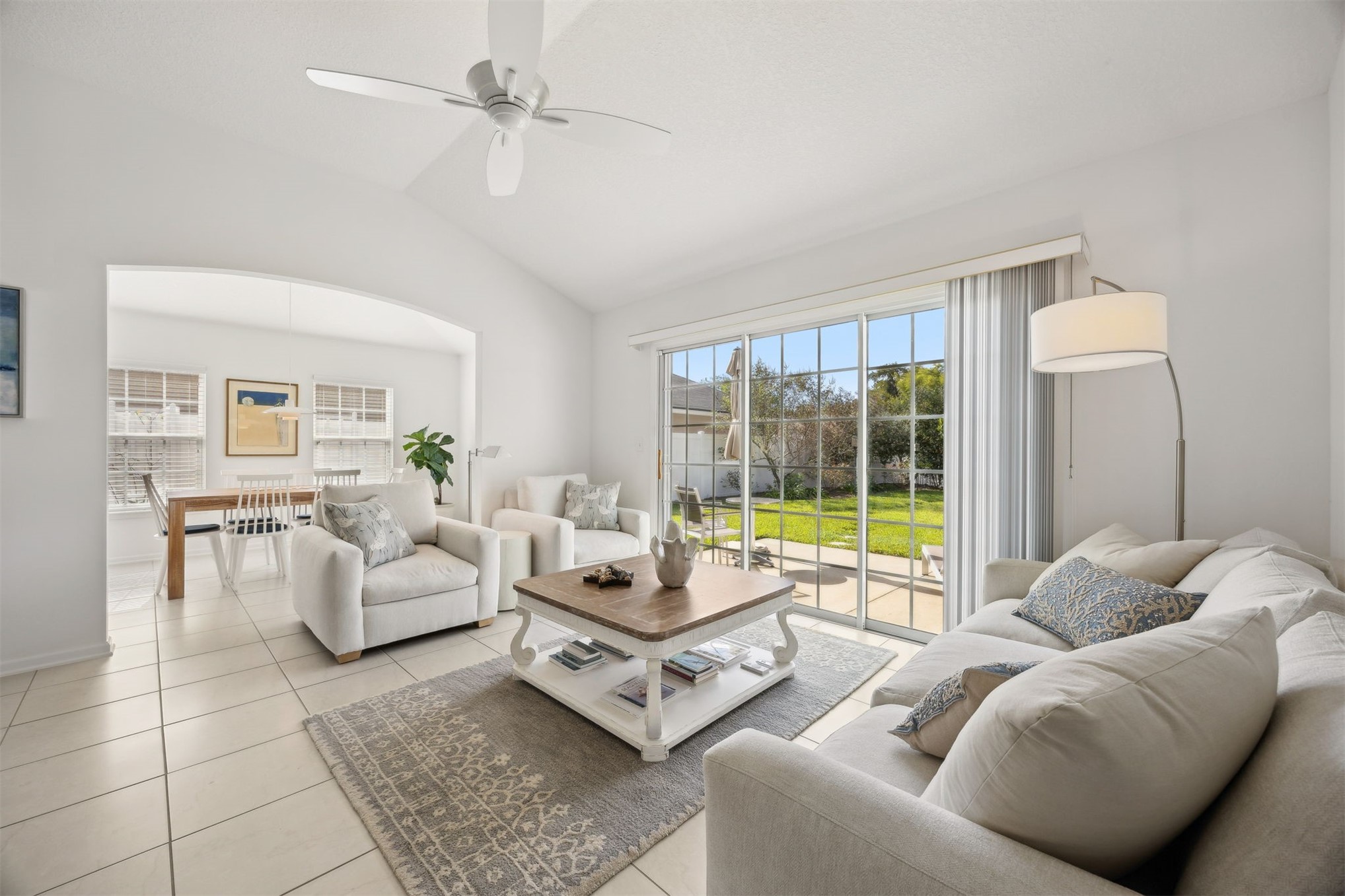 94037 Last Lane Yulee, FL 32097 - Photo 13 of 38 a living room with furniture and a floor to ceiling window