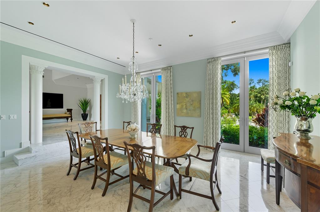 3315 Bay Shore Road Sarasota, FL 34234 - Photo 6 of 96 a view of a dining room with furniture and chandelier
