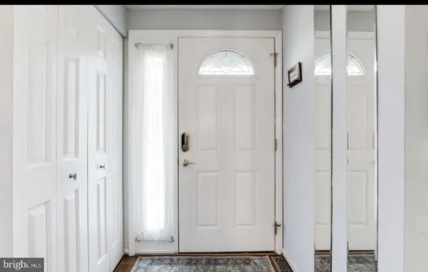 a view of a bathroom with wooden floor