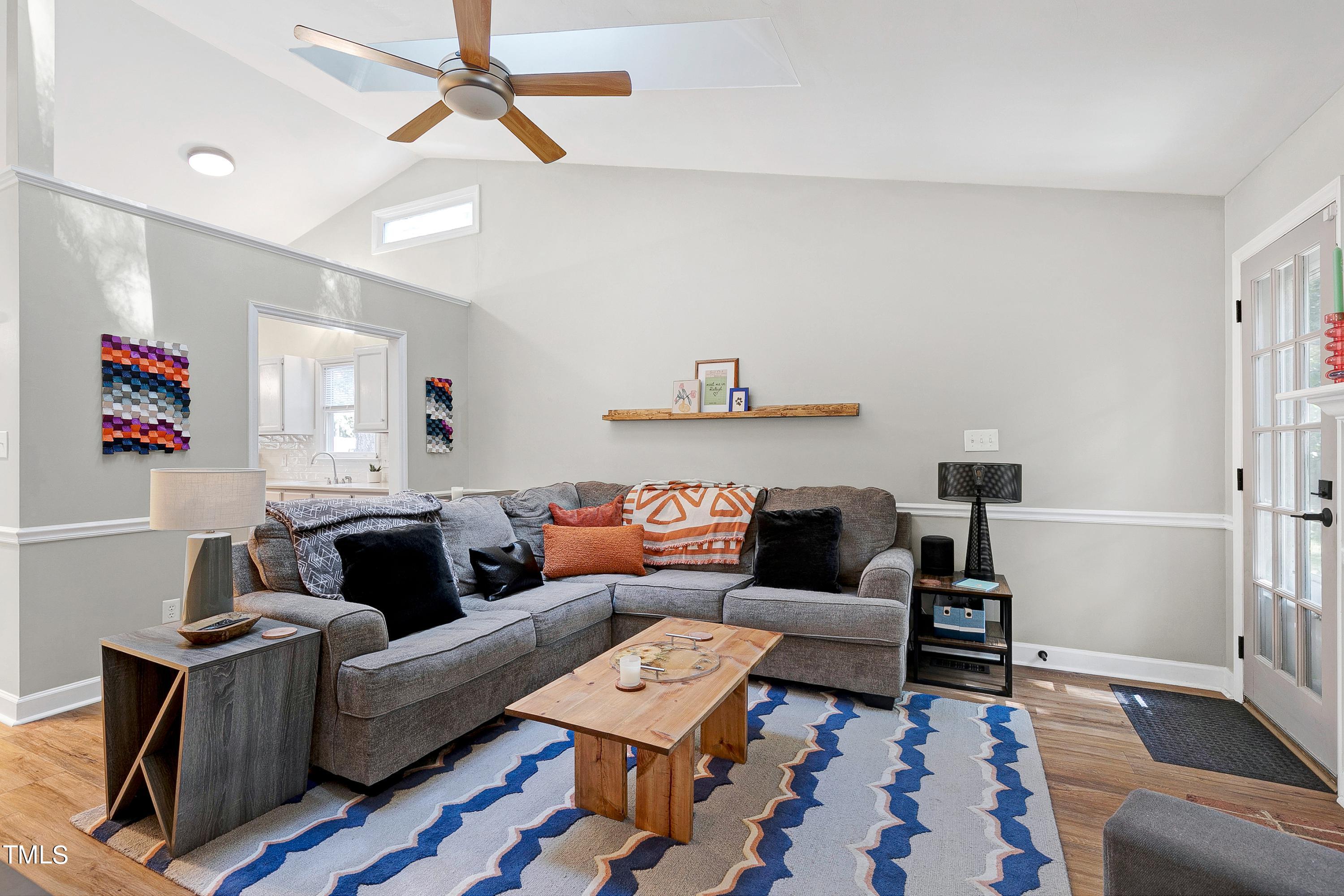 4700 Jacqueline Lane Raleigh, NC 27616 - Photo 20 of 40 a living room with furniture and a rug