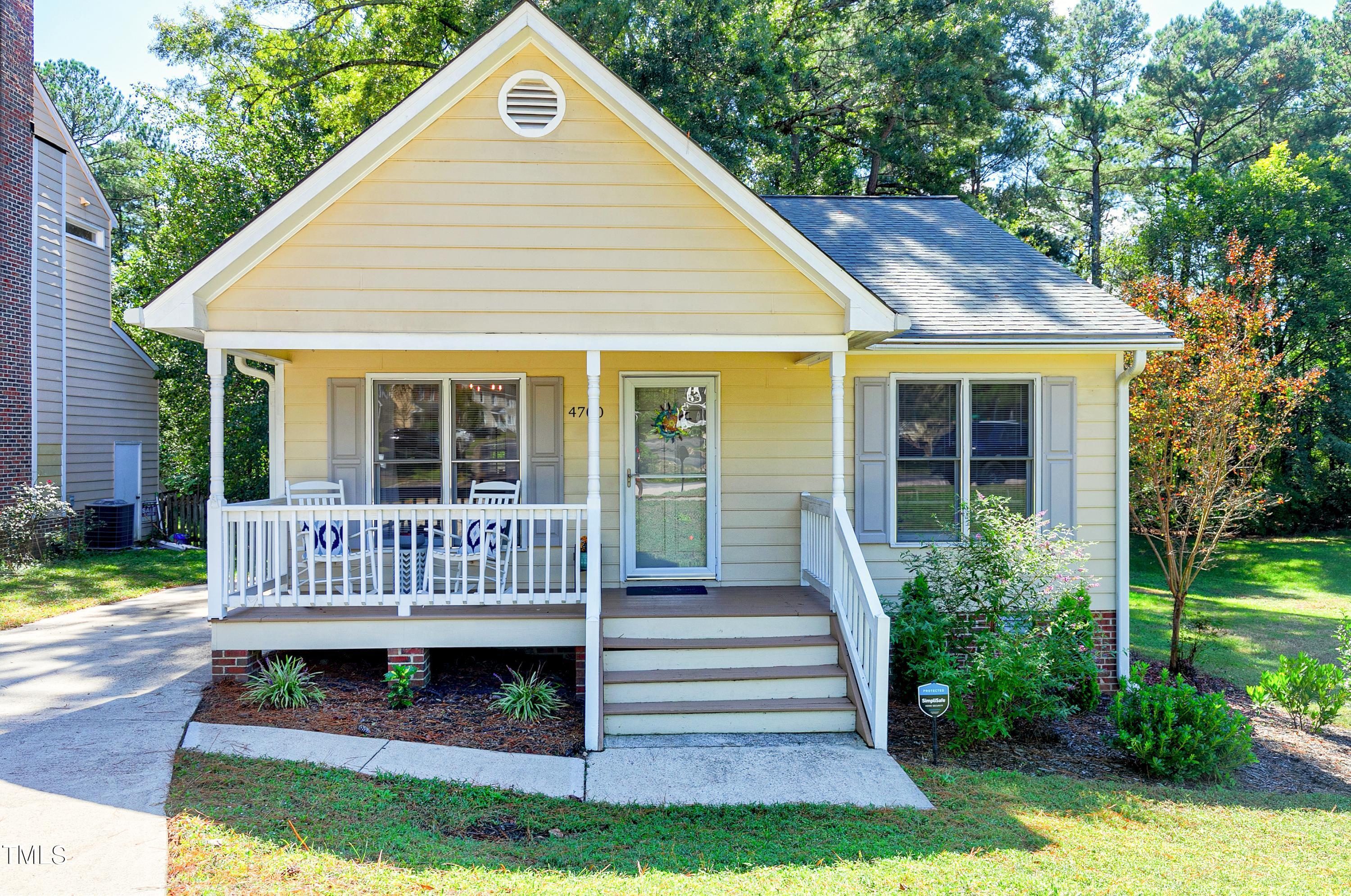 4700 Jacqueline Lane Raleigh, NC 27616 - Photo 2 of 40 a view of a house with a yard deck and a small yard