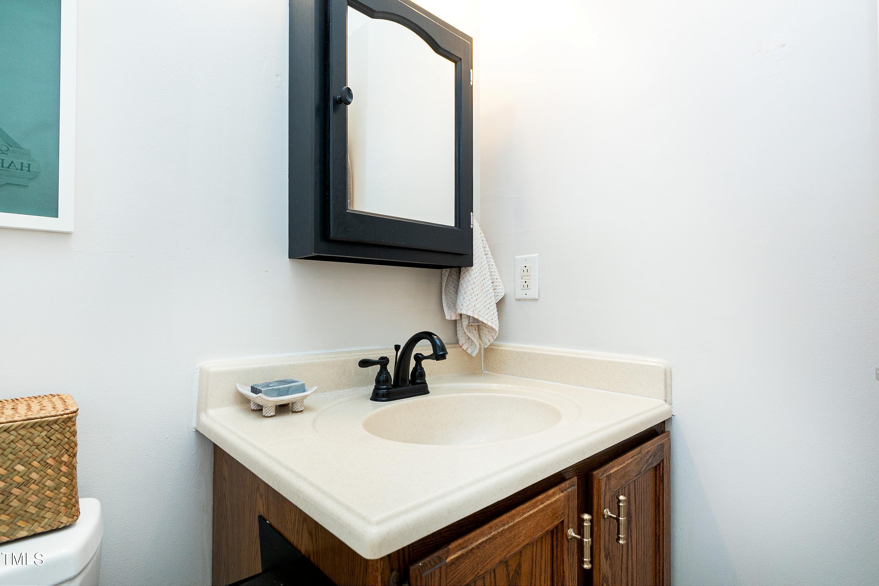 4700 Jacqueline Lane Raleigh, NC 27616 - Photo 25 of 40 a bathroom with a sink and a toilet