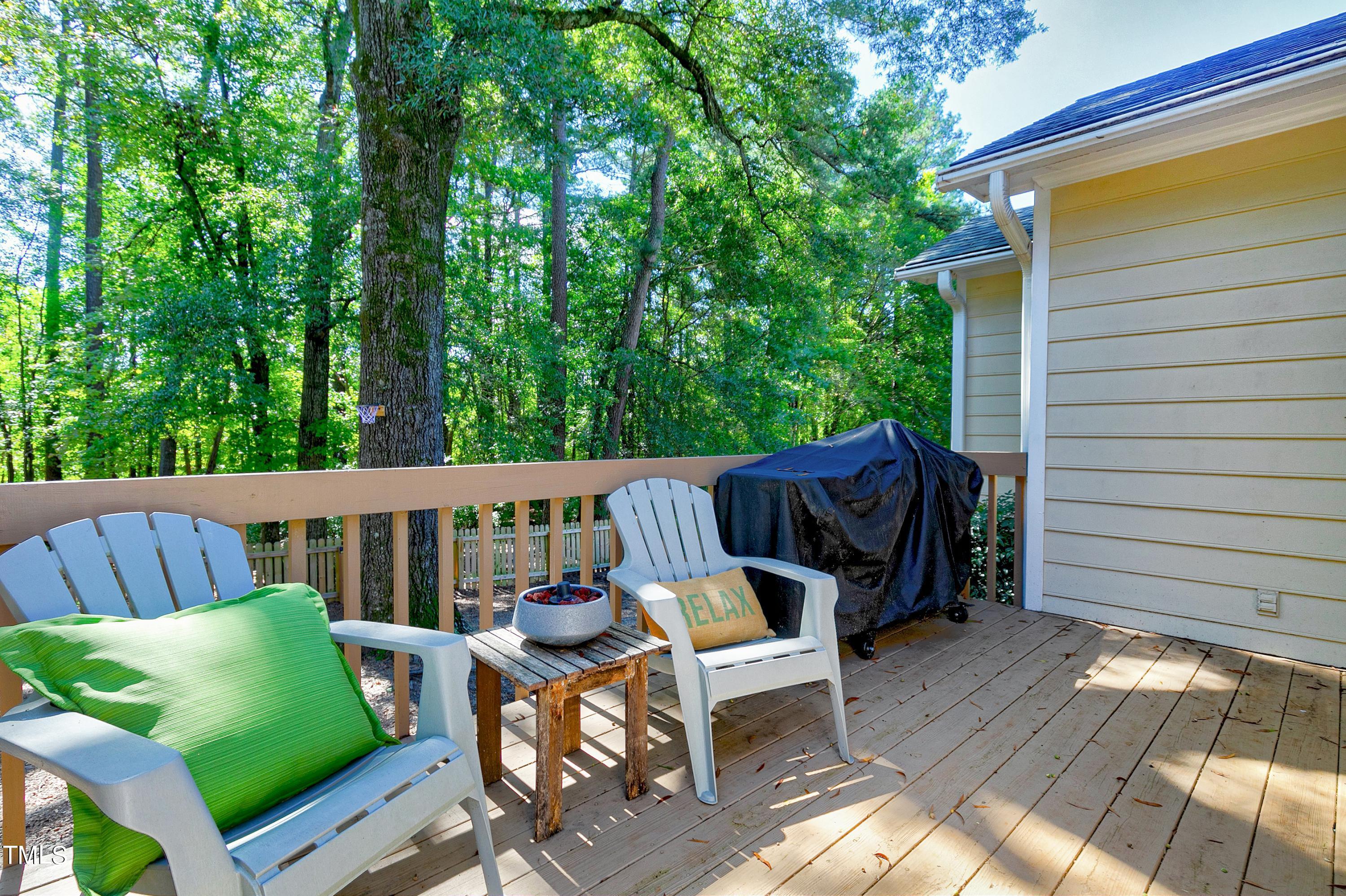4700 Jacqueline Lane Raleigh, NC 27616 - Photo 36 of 40 a view of balcony with wooden floor and outdoor seating