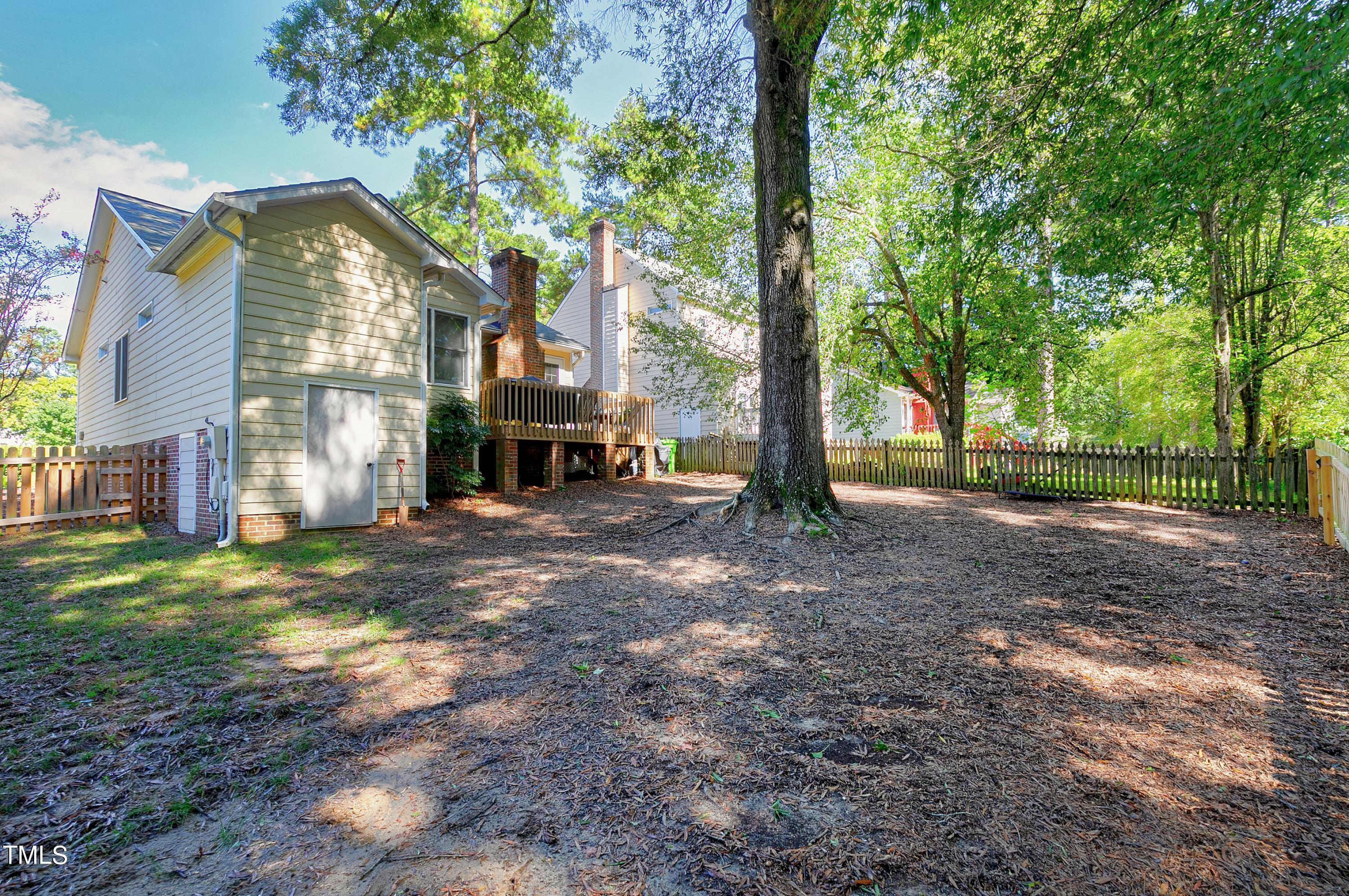 4700 Jacqueline Lane Raleigh, NC 27616 - Photo 38 of 40 a view of a house with a yard and the trees