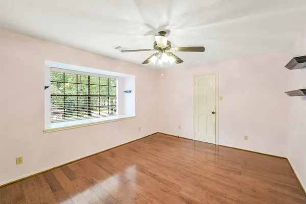 a view of an empty room with a window