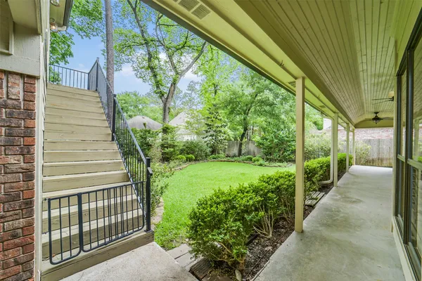 a view of a pathway of a house with a fountain