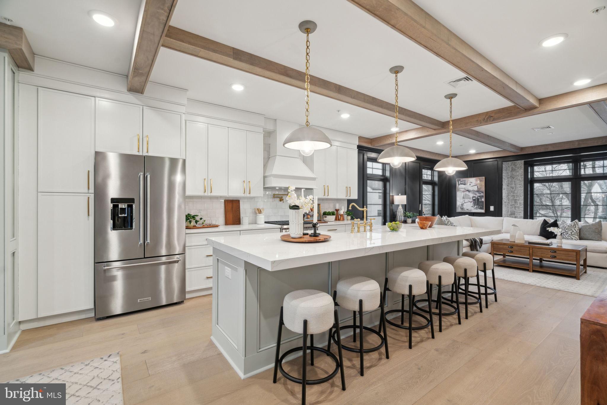 7519 Ridge Avenue, Unit 304 Philadelphia, PA 19128 - Photo 1 of 38 a kitchen with stainless steel appliances a dining table chairs stove and refrigerator