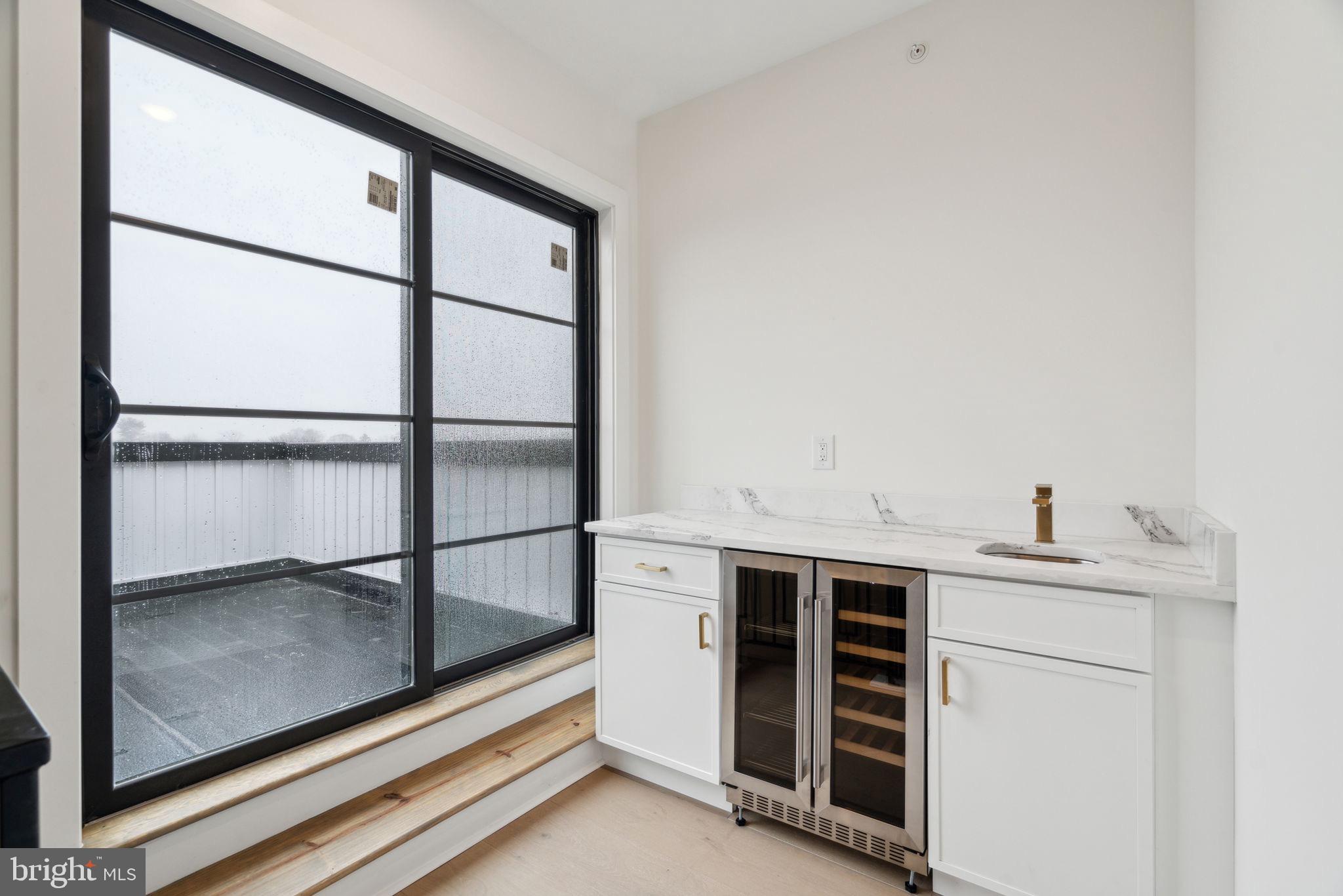 7519 Ridge Avenue, Unit 304 Philadelphia, PA 19128 - Photo 20 of 38 a view of cabinets and window