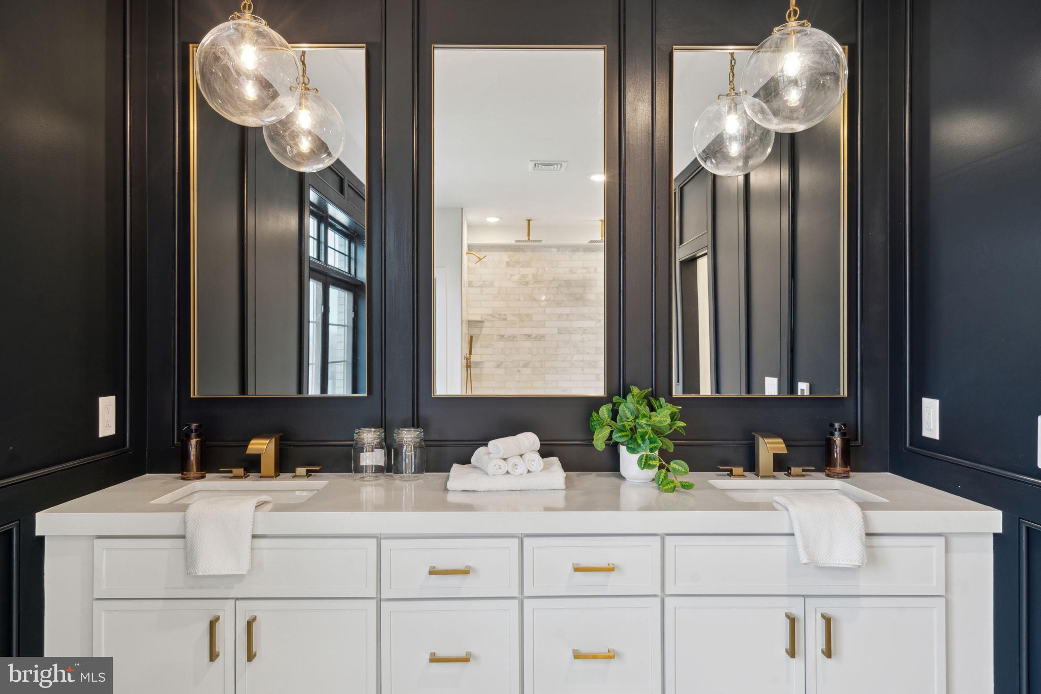 7519 Ridge Avenue, Unit 304 Philadelphia, PA 19128 - Photo 24 of 38 a bathroom with a sink vanity and a mirror