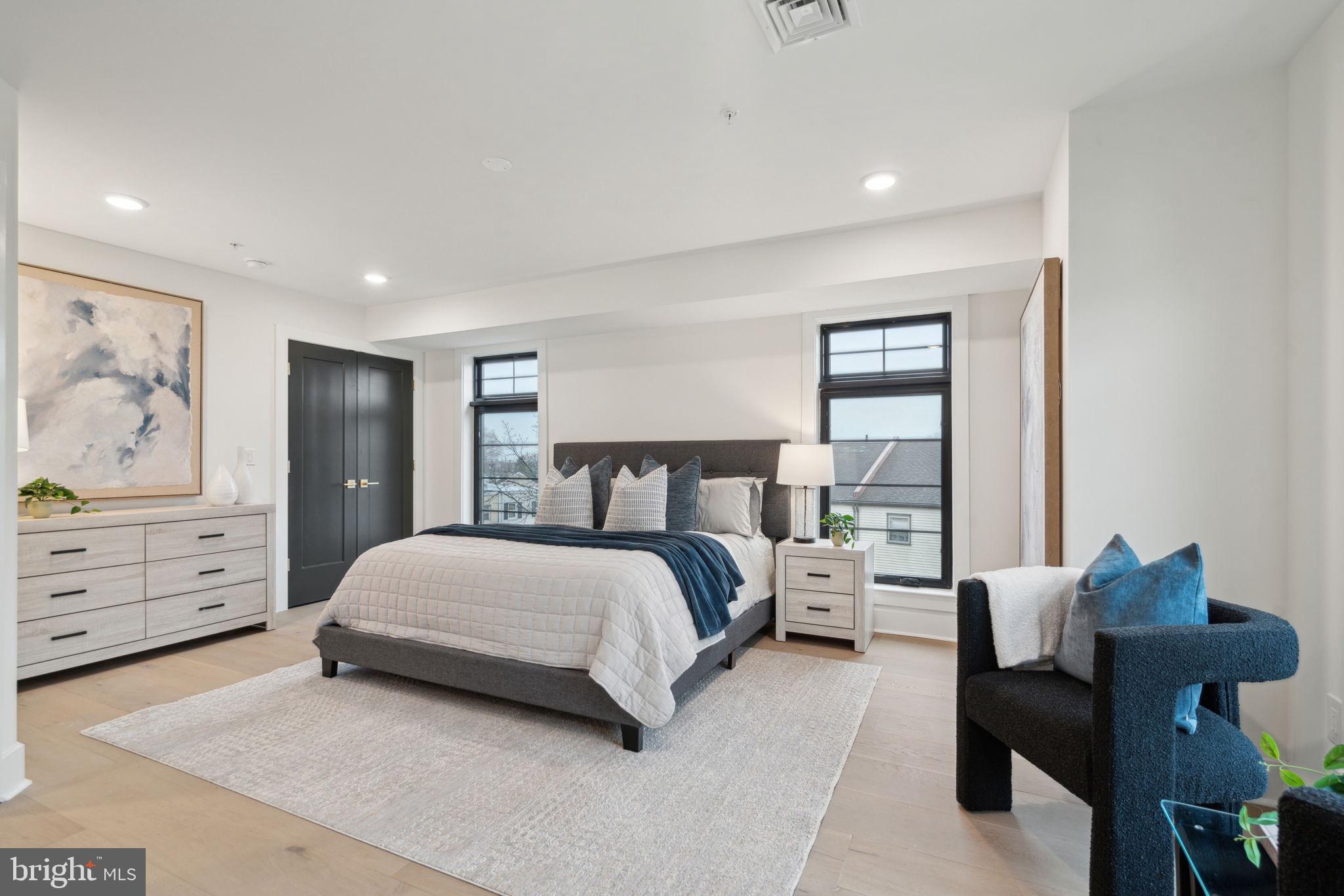 7519 Ridge Avenue, Unit 304 Philadelphia, PA 19128 - Photo 36 of 38 a spacious bedroom with a bed and window