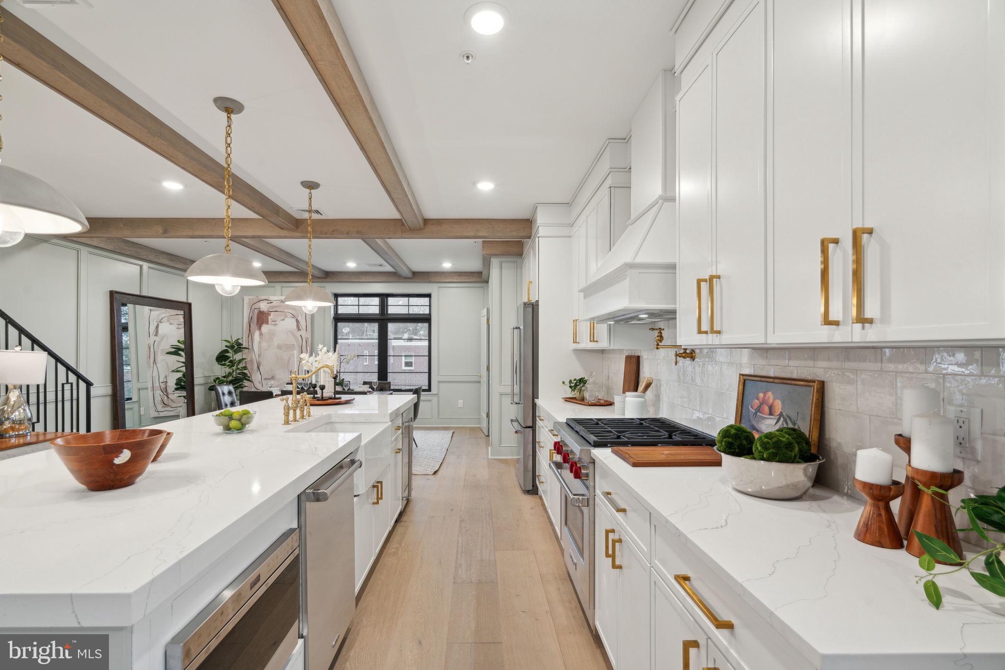 7519 Ridge Avenue, Unit 304 Philadelphia, PA 19128 - Photo 5 of 38 a kitchen with sink stove and cabinets