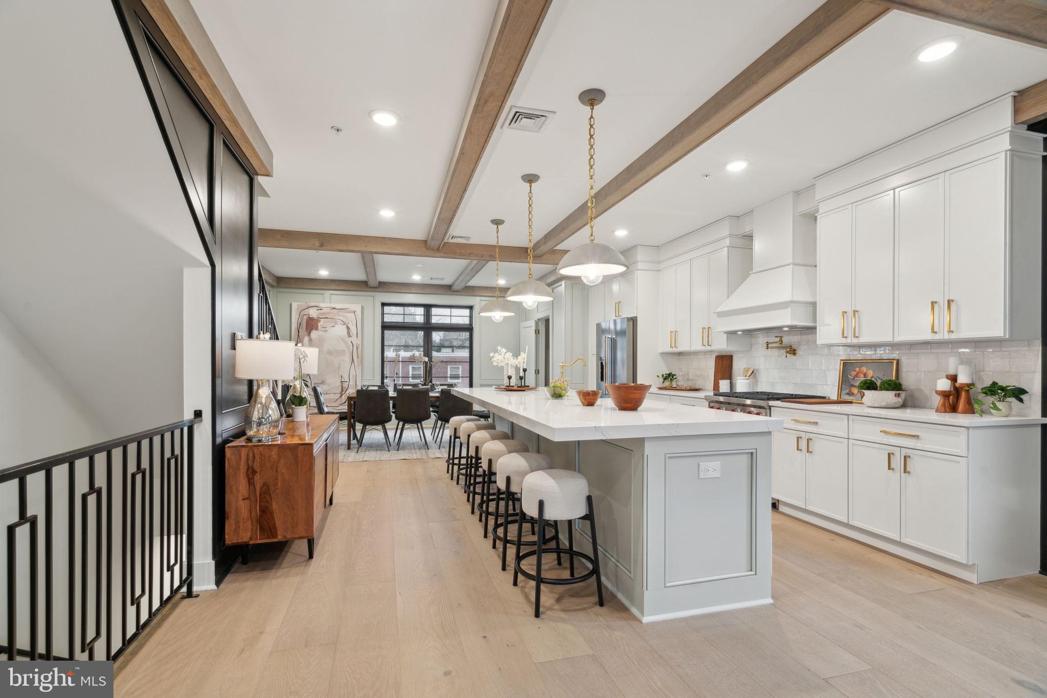 7519 Ridge Avenue, Unit 304 Philadelphia, PA 19128 - Photo 7 of 38 a kitchen with lots of counter top space and furniture