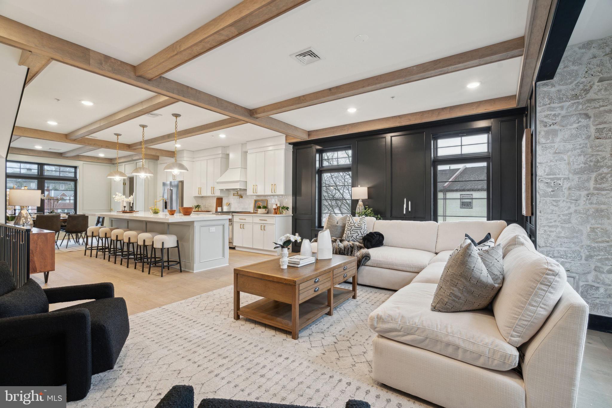 7519 Ridge Avenue, Unit 304 Philadelphia, PA 19128 - Photo 10 of 38 a living room with furniture and a table