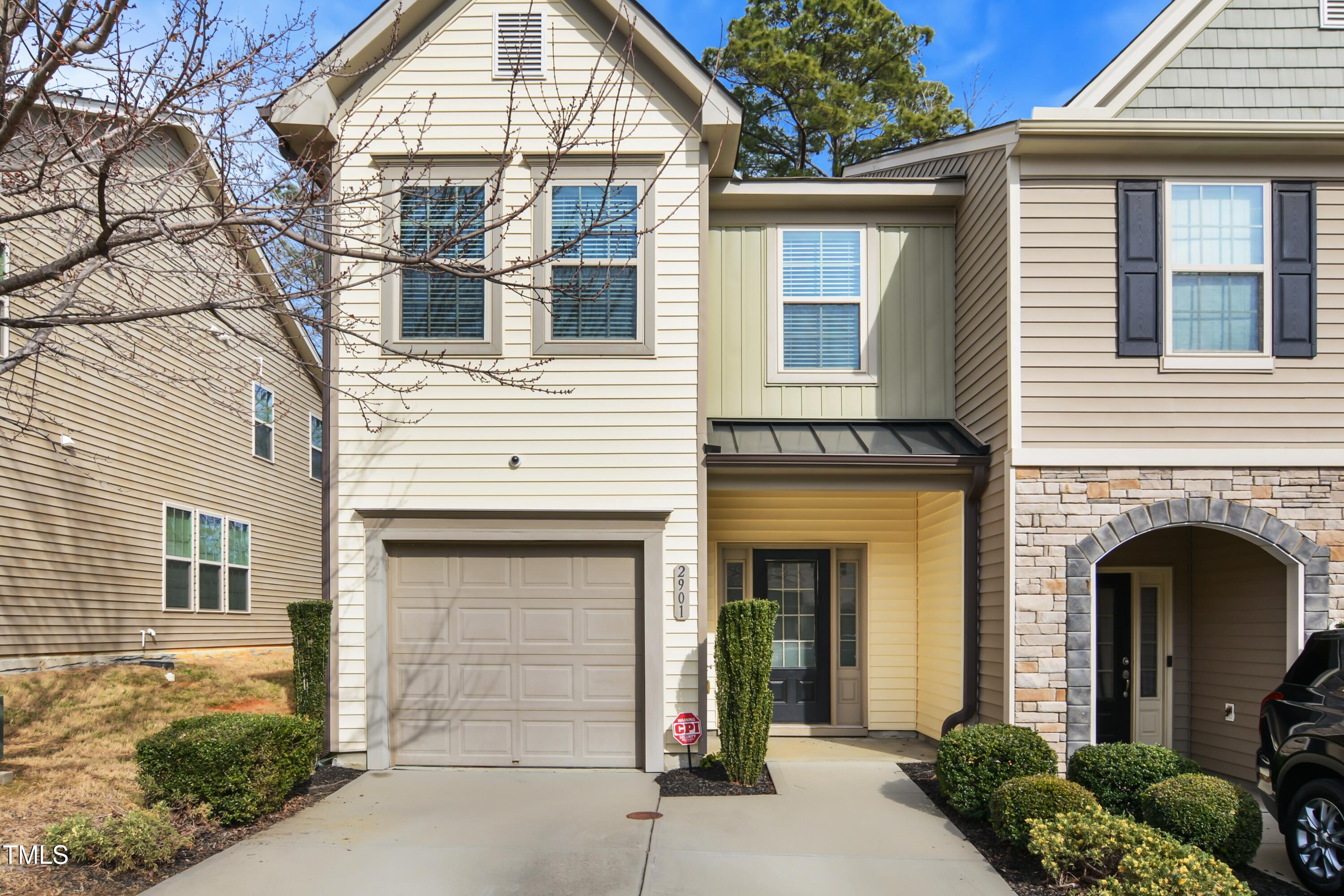 2901 Benevolence Drive Raleigh, NC 27610 - Photo 1 of 18 a front view of a house with a garden
