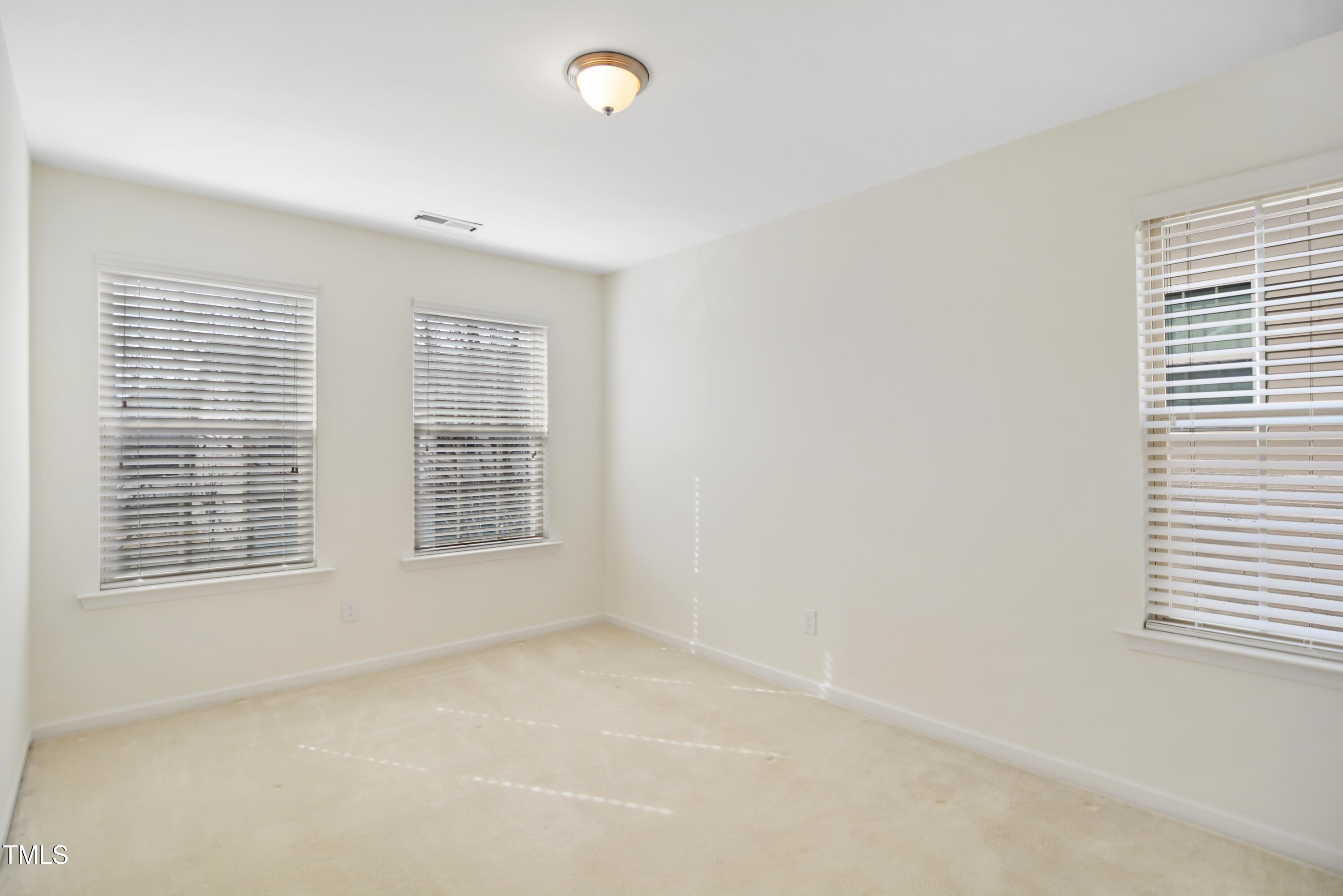 2901 Benevolence Drive Raleigh, NC 27610 - Photo 14 of 18 an empty room with a window