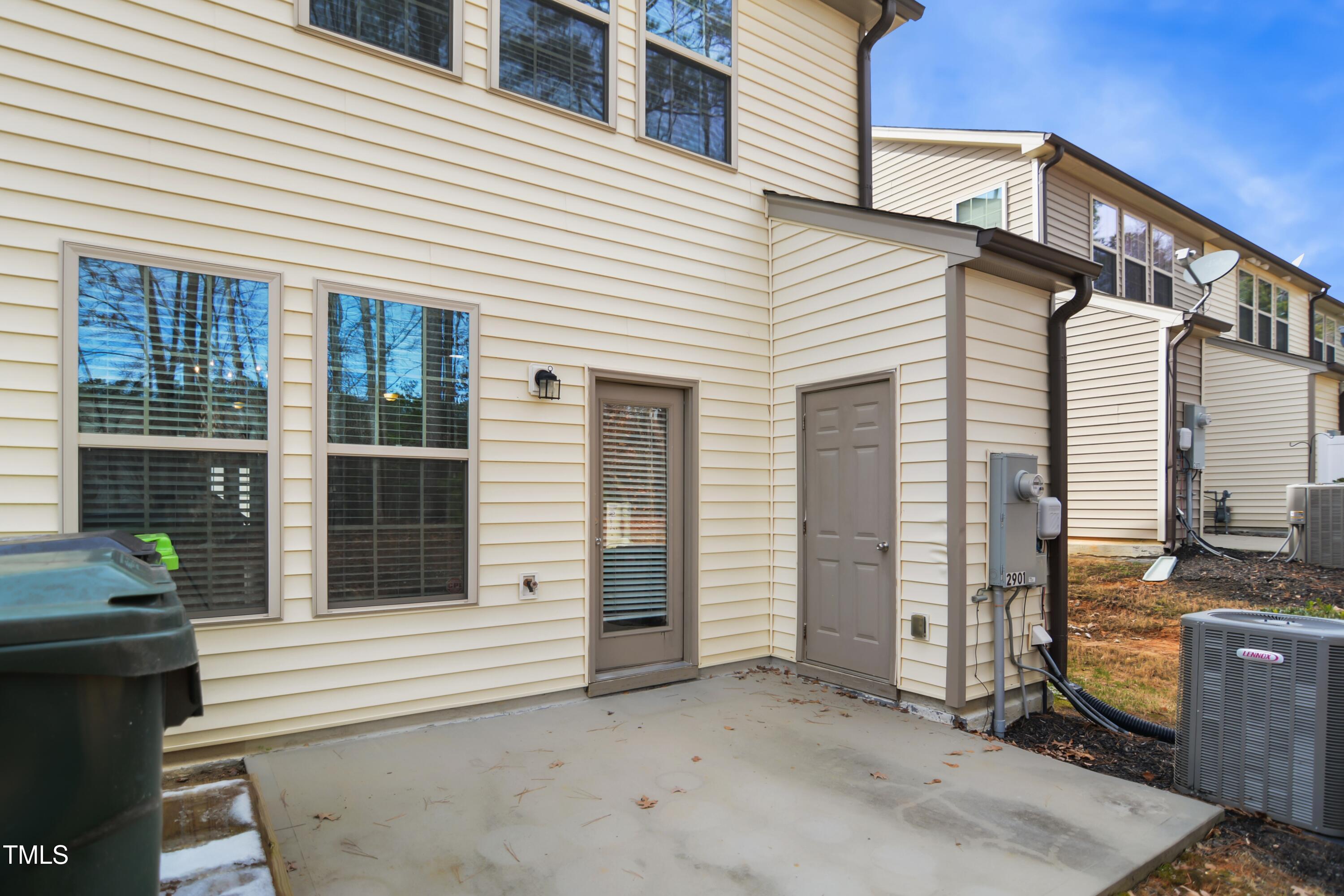 2901 Benevolence Drive Raleigh, NC 27610 - Photo 17 of 18 a view of a house with a door and a window