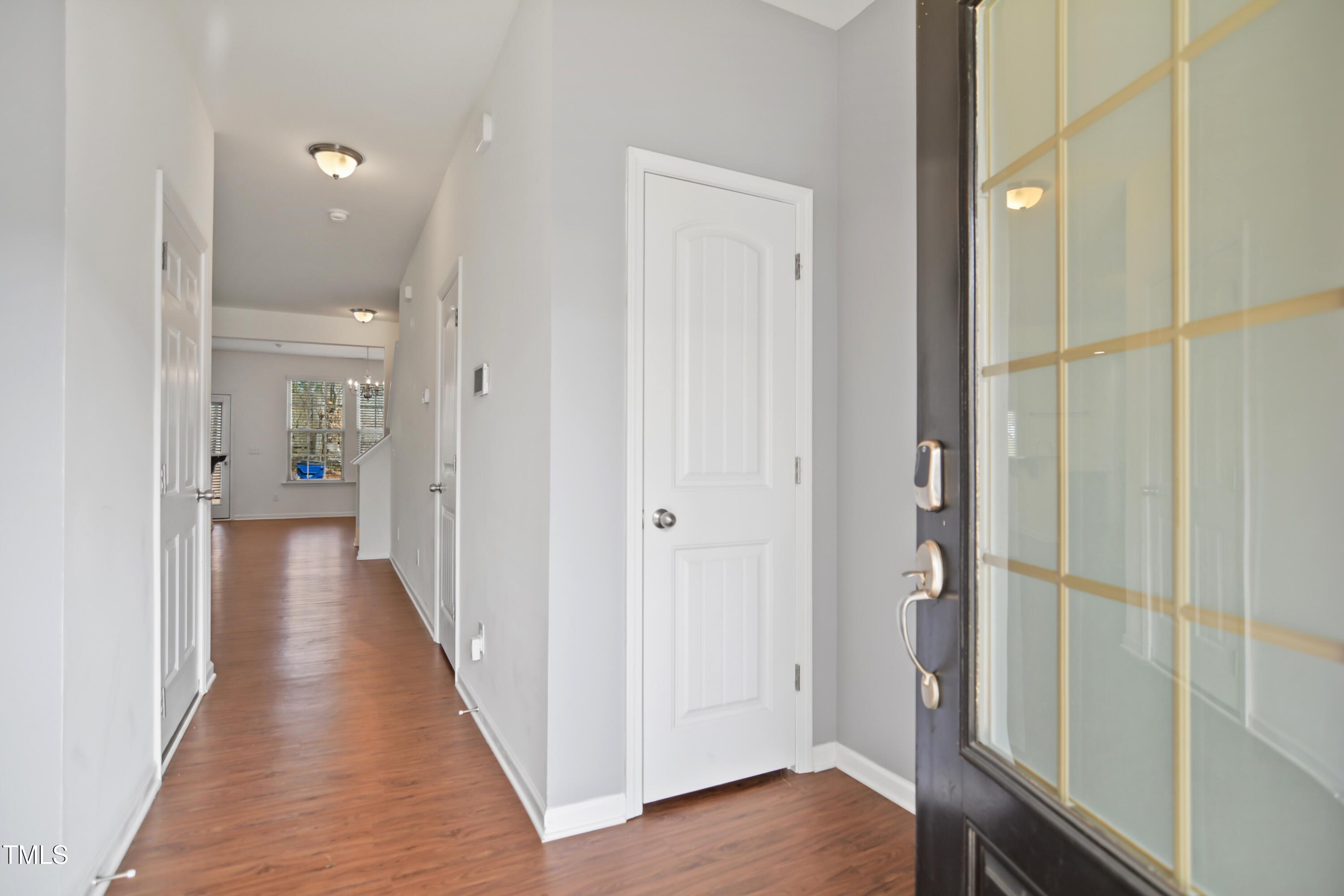 2901 Benevolence Drive Raleigh, NC 27610 - Photo 2 of 18 a view of a hallway with wooden floor