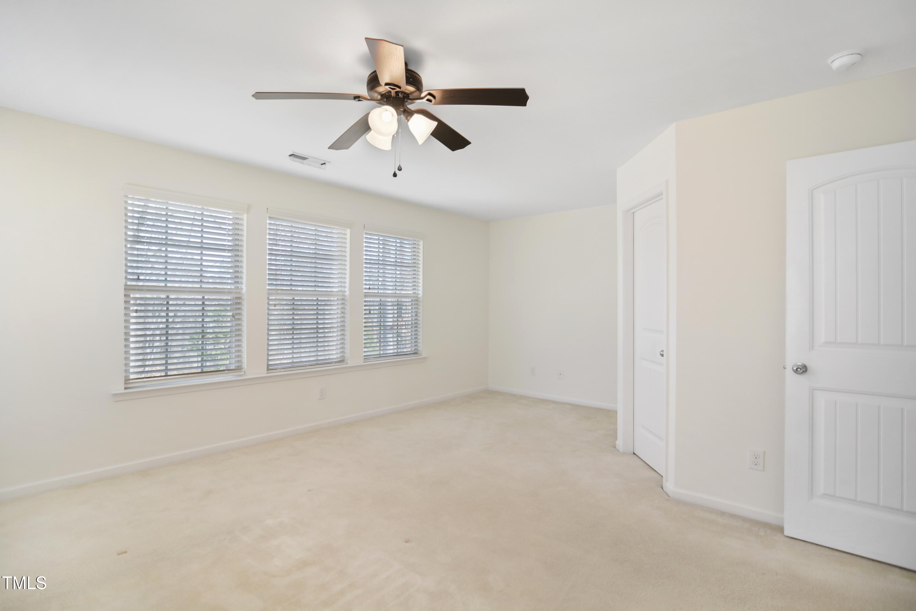 2901 Benevolence Drive Raleigh, NC 27610 - Photo 9 of 18 a view of an empty room with a window