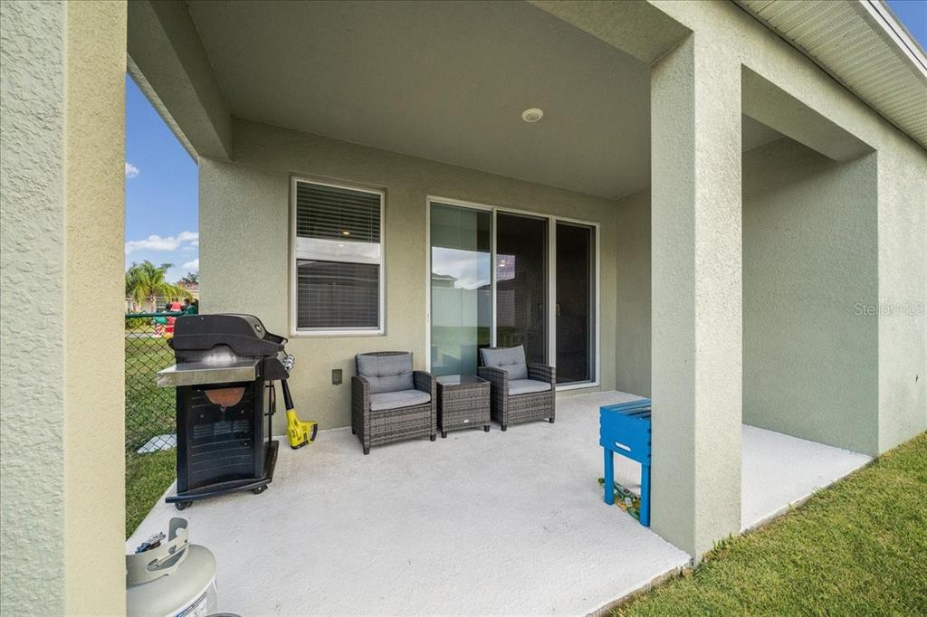 6138 Southwest 89th Ln Road Ocala, FL 34476 - Photo 53 of 74 a front view of a house with outdoor seating