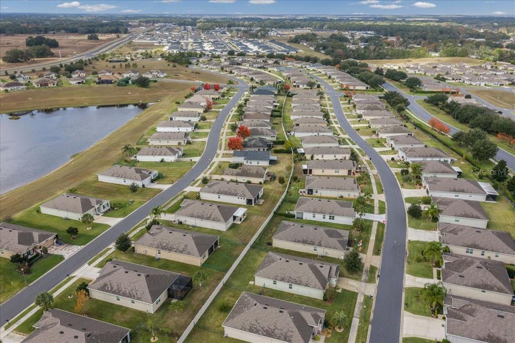 6138 Southwest 89th Ln Road Ocala, FL 34476 - Photo 63 of 74 an aerial view of residential houses with outdoor space