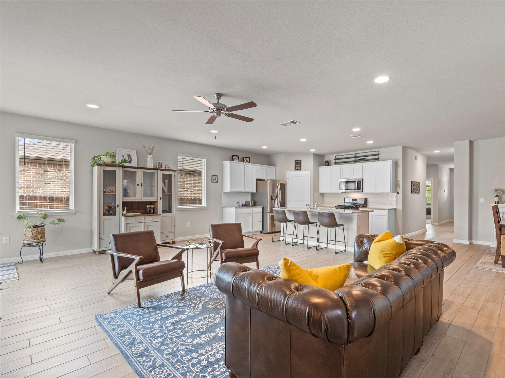4104 Porter Farm Road Georgetown, TX 78628 - Photo 1 of 1 Living area featuring light wood-type flooring, ceiling fan, and recessed lighting