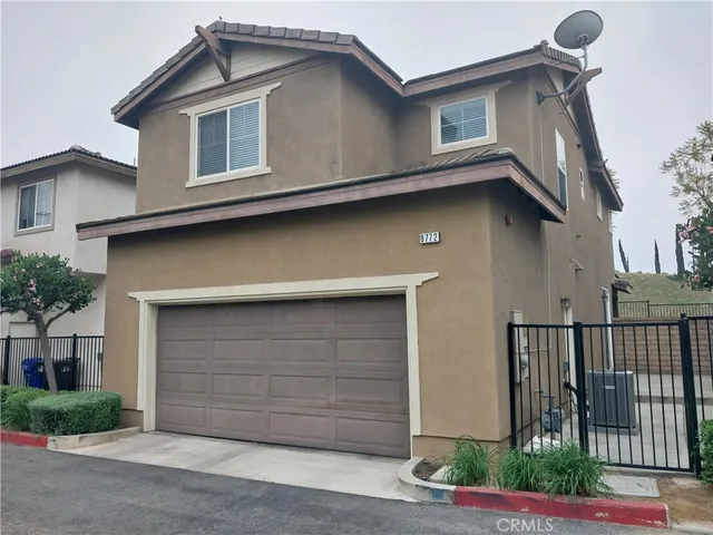 a front view of a house with garage