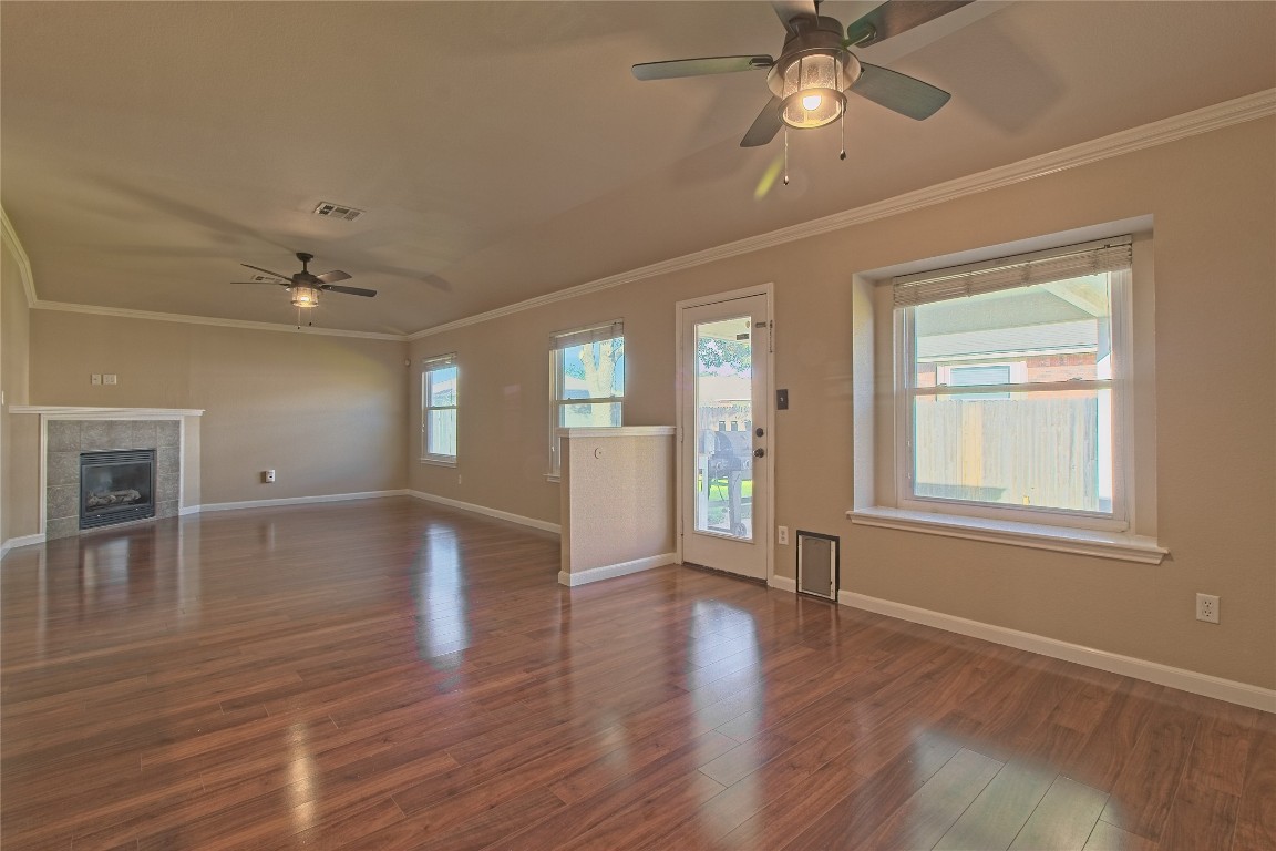 3112 Clinton Place Round Rock, TX 78665 - Photo 19 of 36 a view of an empty room with wooden floor and a window