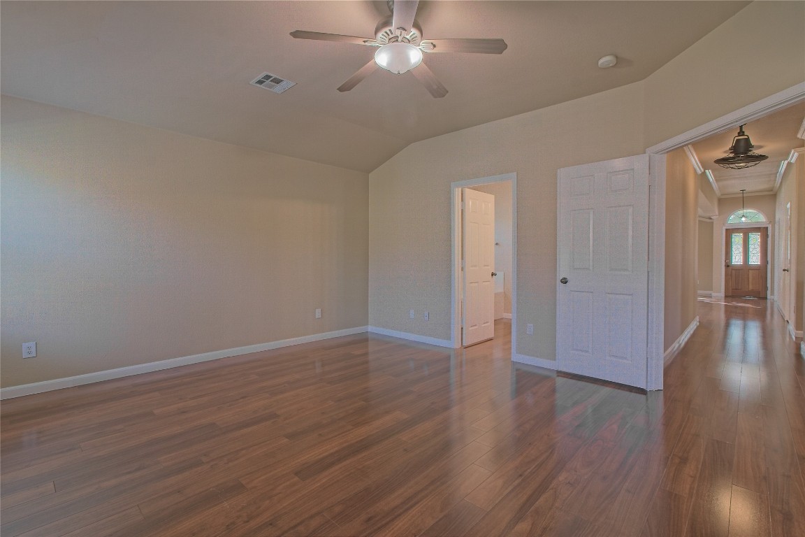 3112 Clinton Place Round Rock, TX 78665 - Photo 22 of 36 a view of an empty room with wooden floor