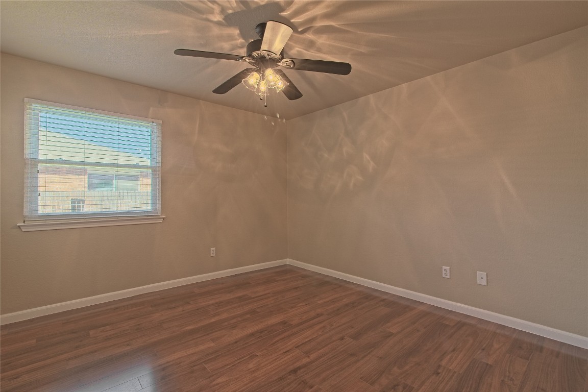 3112 Clinton Place Round Rock, TX 78665 - Photo 26 of 36 a view of a room with wooden floor and windows