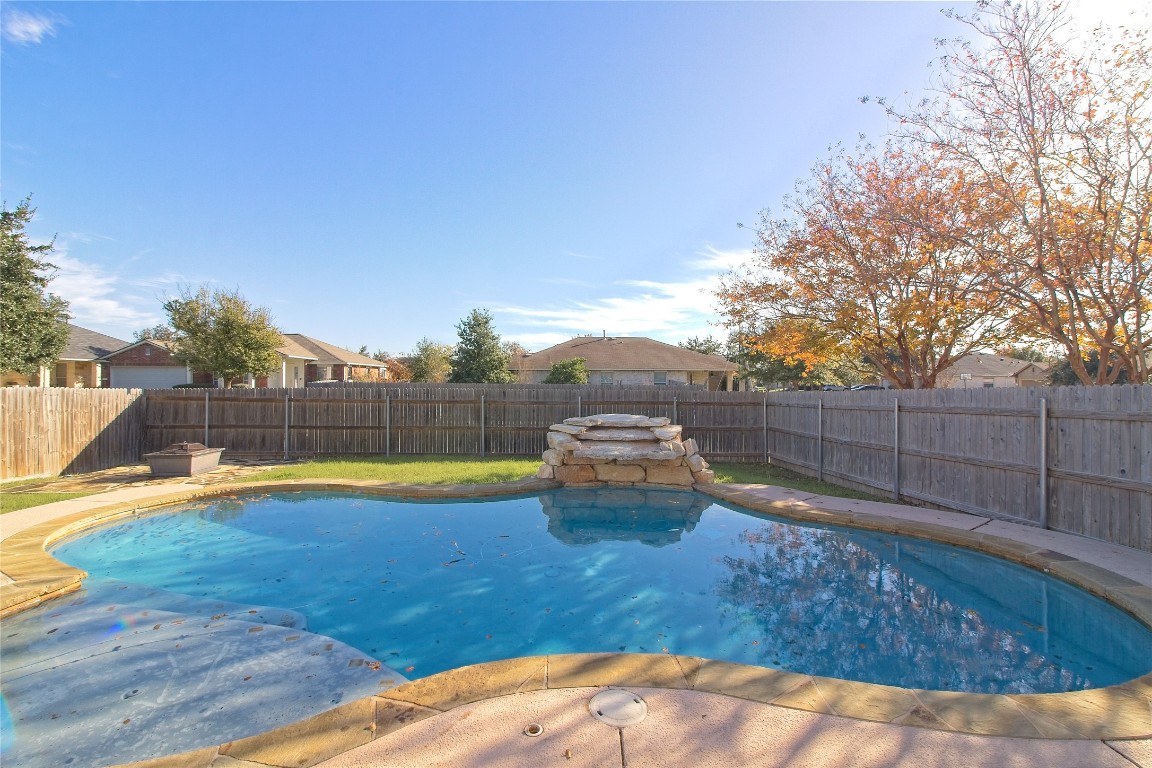 3112 Clinton Place Round Rock, TX 78665 - Photo 36 of 36 a view of a backyard with swimming pool in the background
